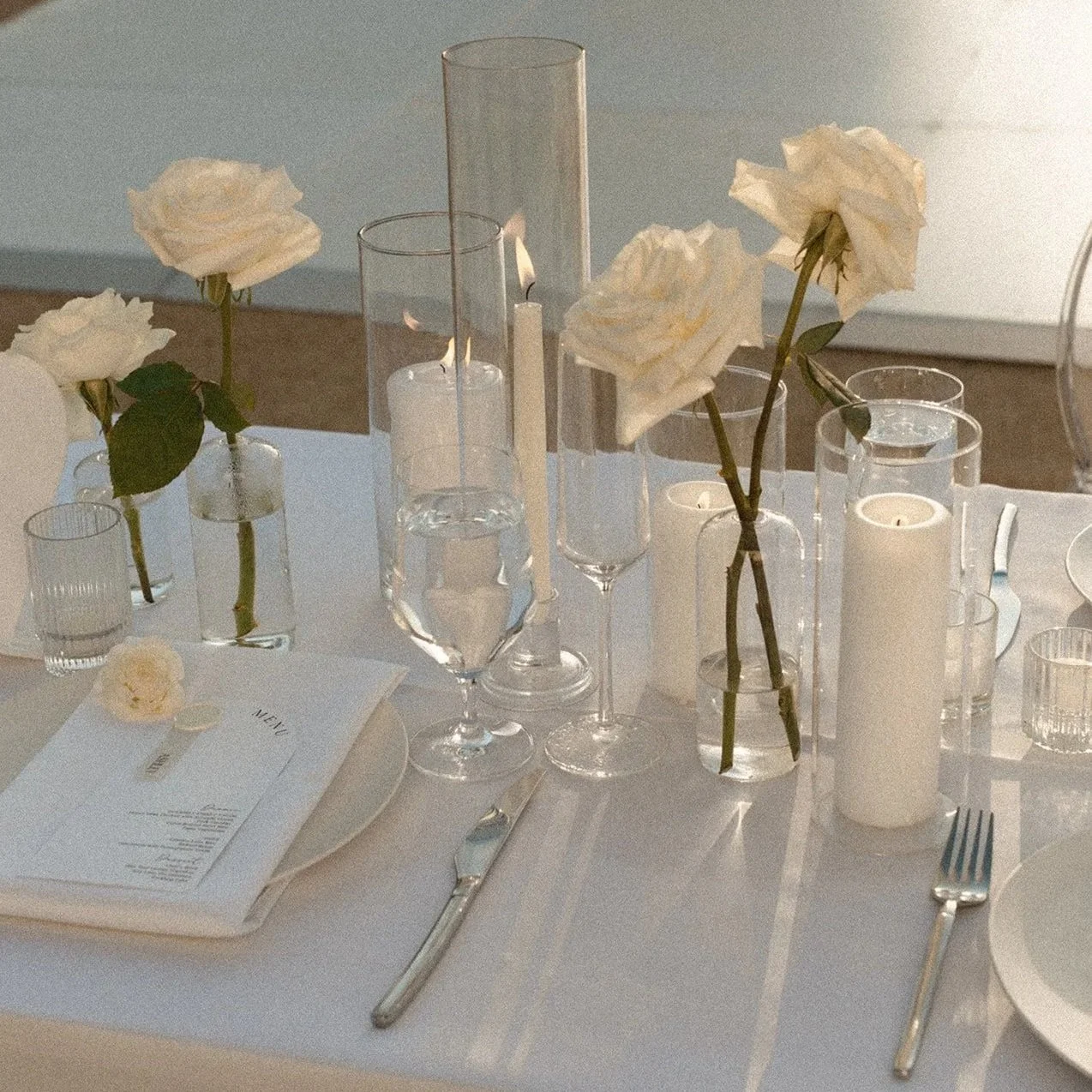 Editorial wedding table styling with white roses and candlelight, designed by 1209 Creative at The Icehouse in Phoenix, Arizona.