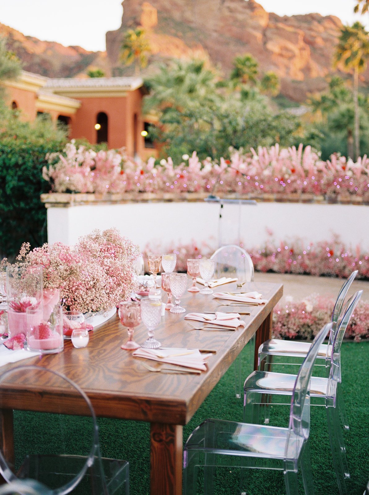 Outdoor wedding reception tablescape with pink florals at Omni Scottsdale Resort designed by 1209 Creative, Scottsdale Arizona wedding florist