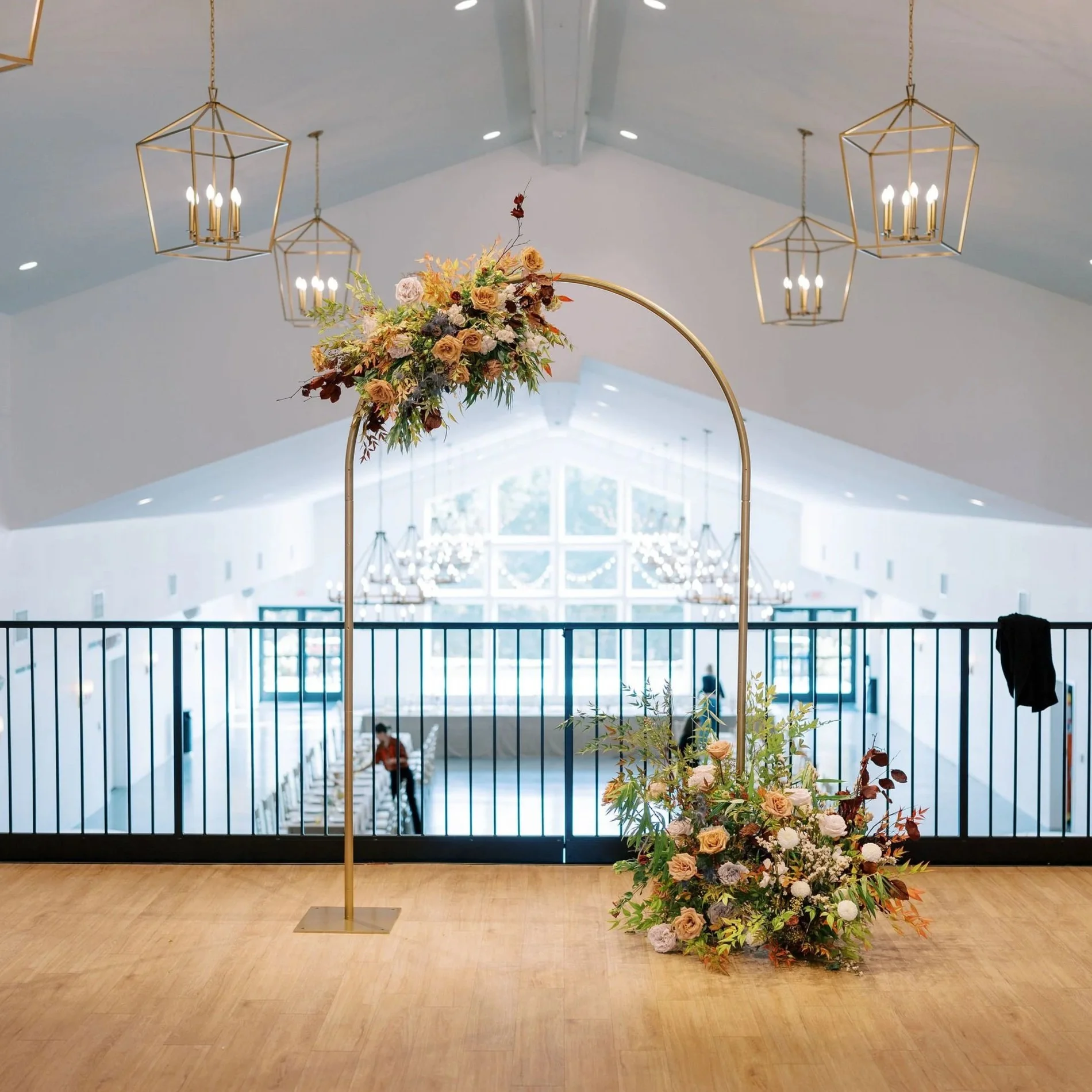 Wedding ceremony arch with lush floral installation designed by 1209 Creative at The Eloise in Madison Wisconsin, featuring an elevated editorial wedding design