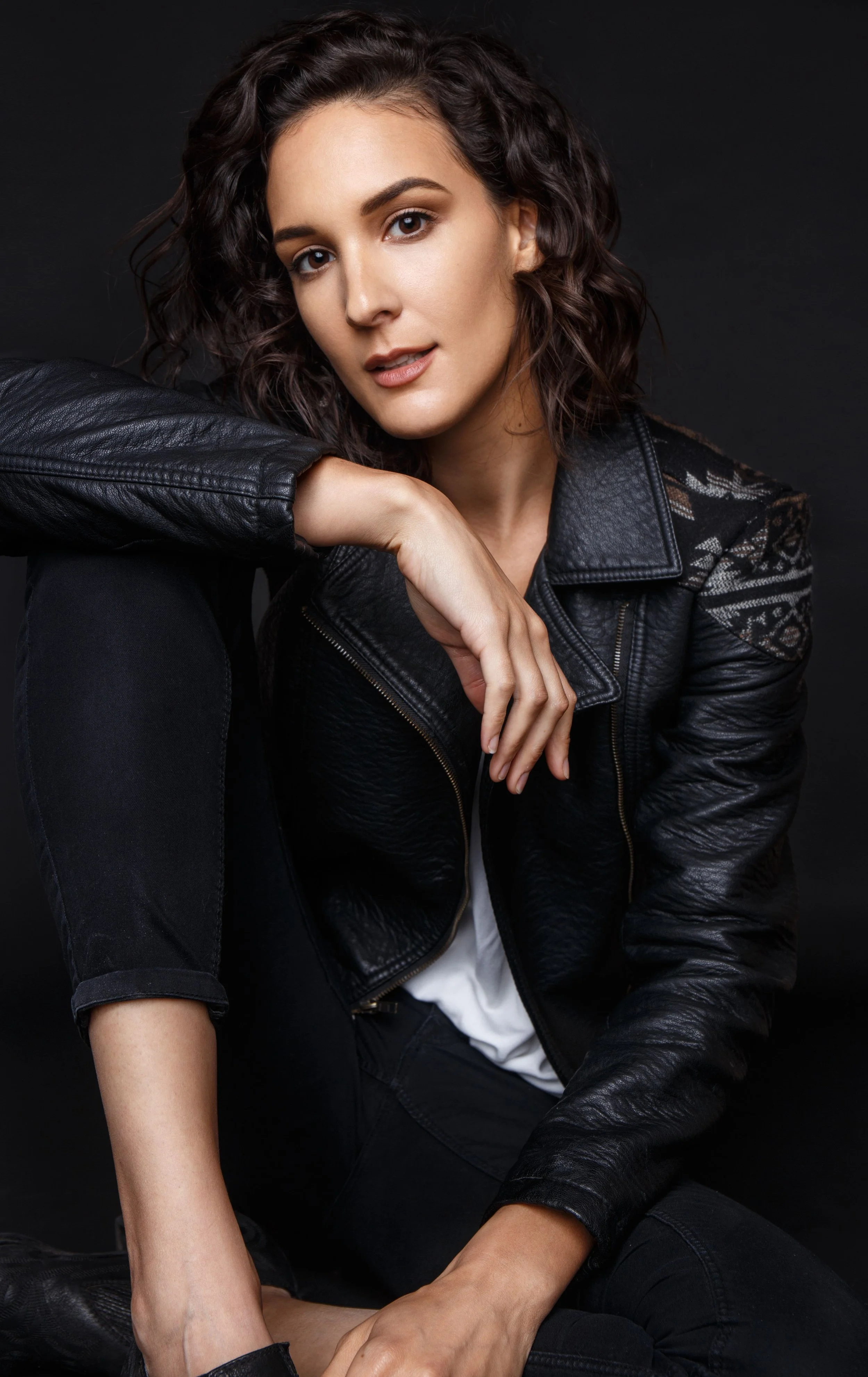 Portrait of Sara Jihan Fassil, lead wedding florist and creative director of 1209 Creative, specializing in modern and organic wedding floral design.