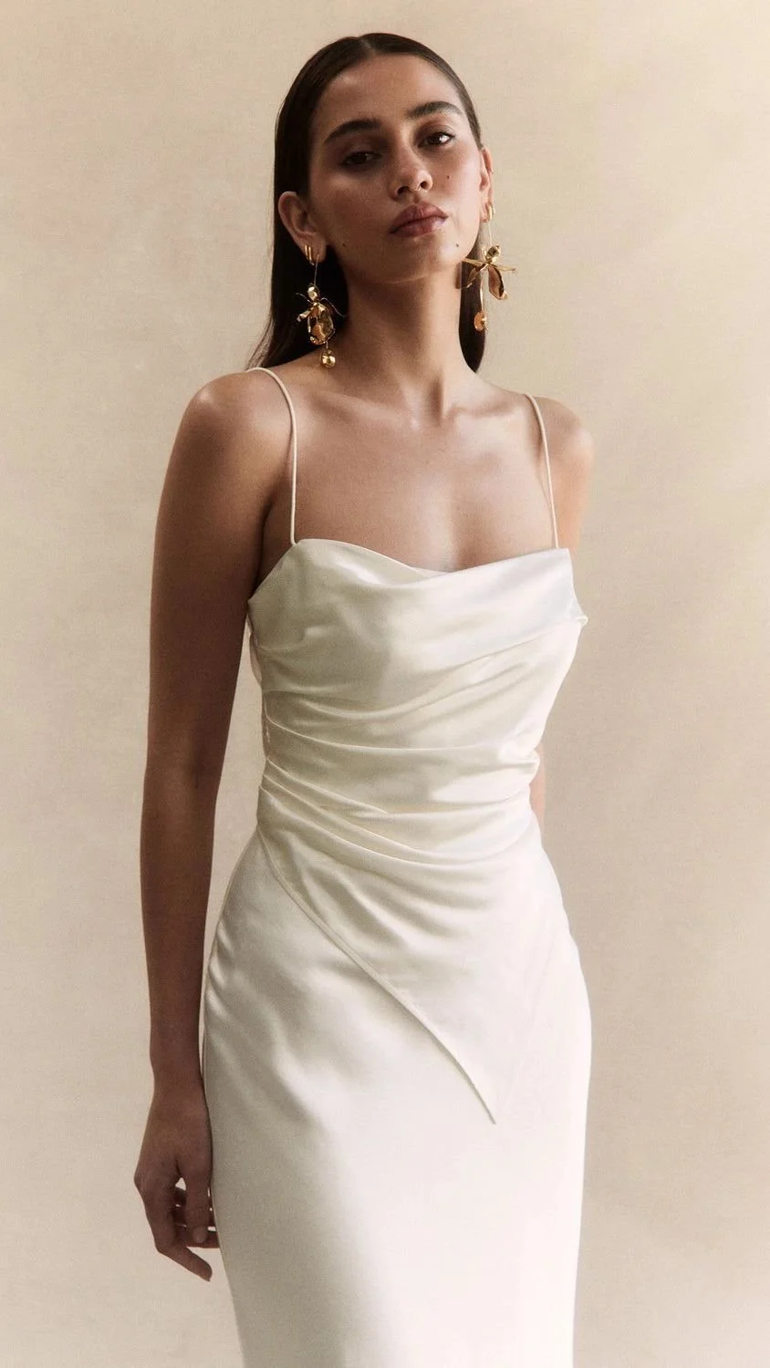 Minimalist wedding dress featuring a softly draped bodice and delicate straps for a modern Phoenix bride
