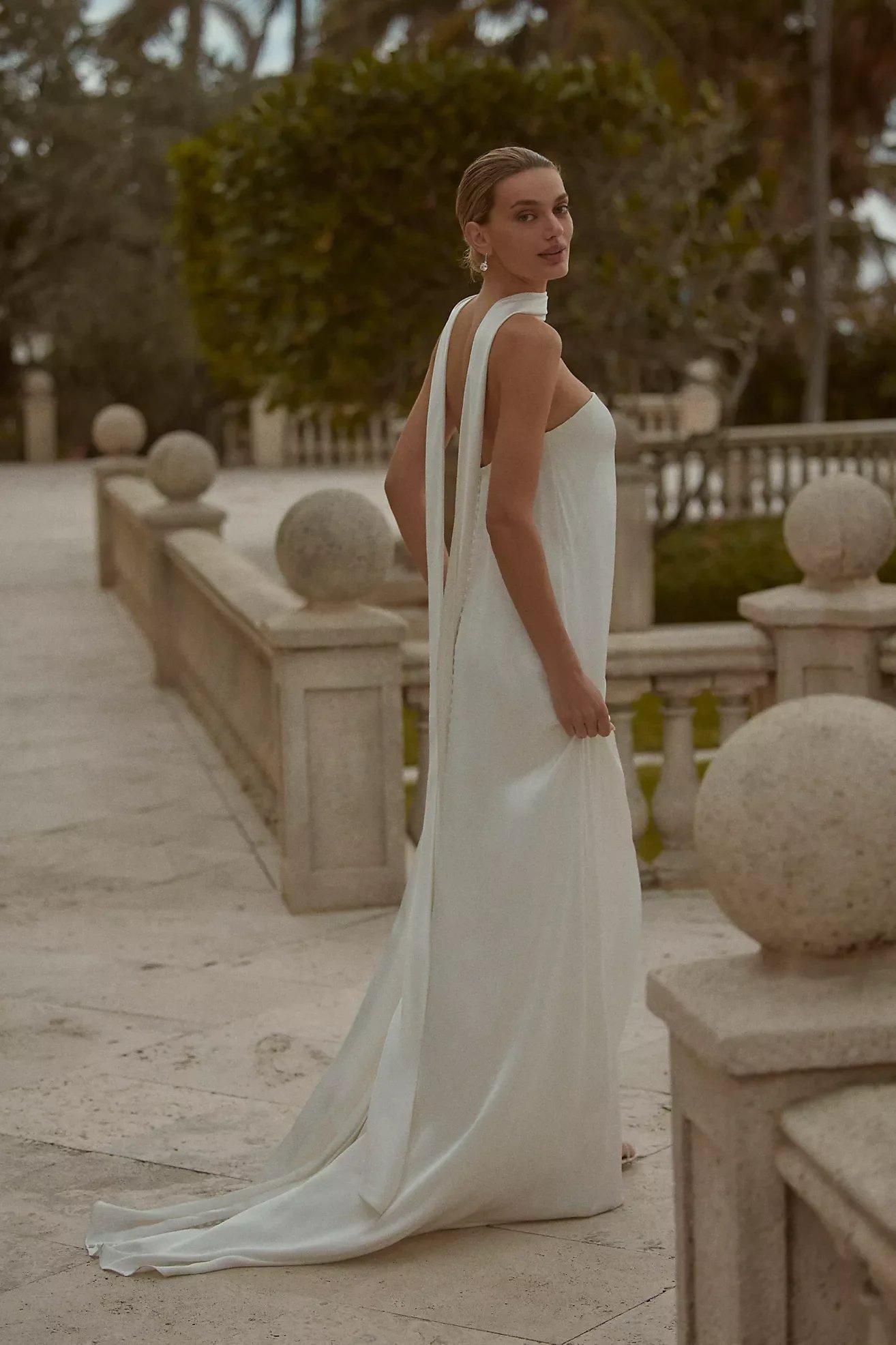 Minimalist wedding dress with long back ties photographed outdoors, suited for a modern Scottsdale or Phoenix wedding