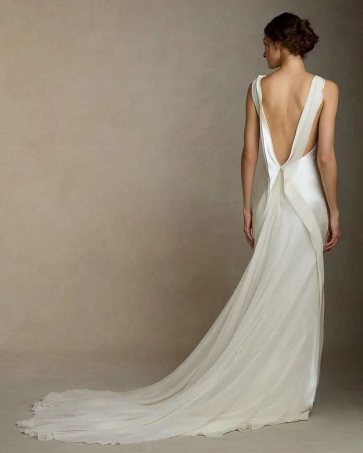 Minimalist bride wearing a low back ivory wedding dress with soft drape, ideal for a modern Phoenix wedding