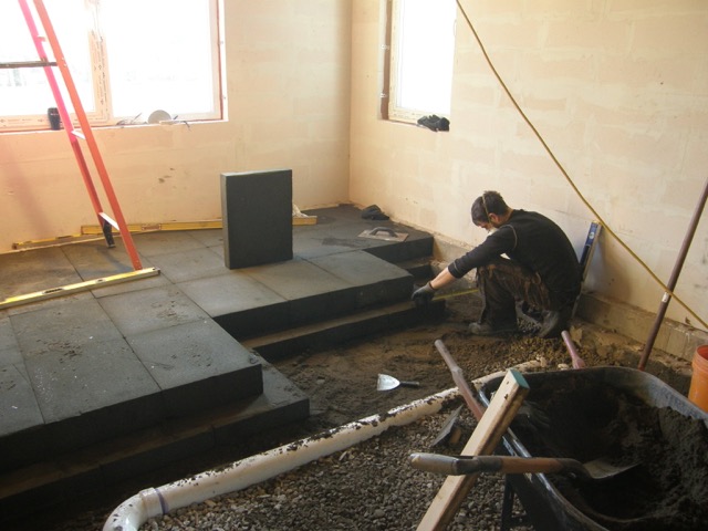 Installing Foamglas in two staggered layers of 4 inch and 6 inch.