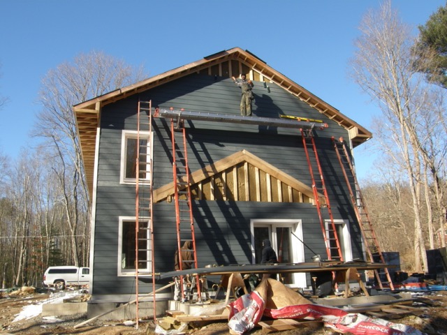 Fiber-cement siding nearing completion.
