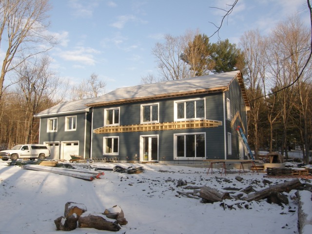 Fiber-cement siding nearing completion.
