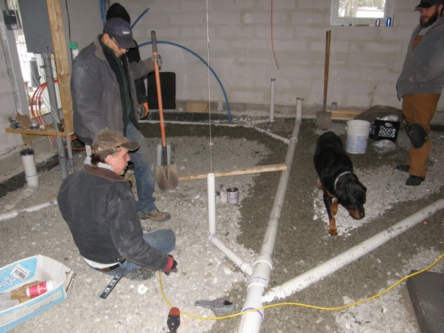   The plumber's apprentice studying the sub-slab plumbing system.  