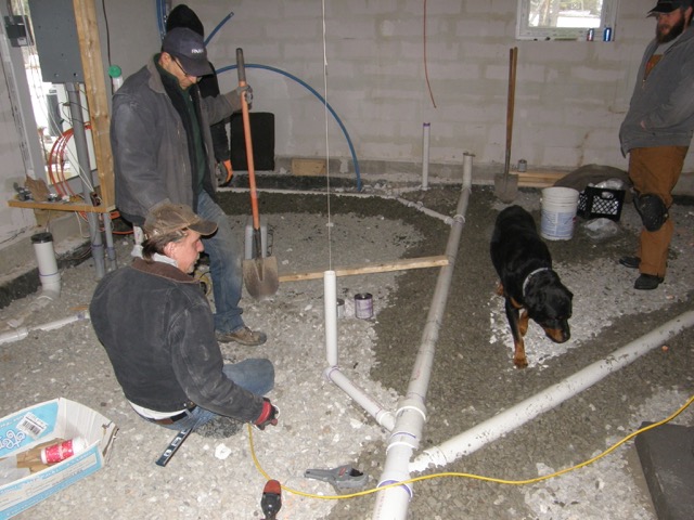 The plumber's apprentice studying the sub-slab plumbing system.