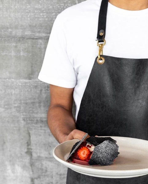 Strawberries with raspberry cremeaux, lavender, honey cream & charcoal meringue.