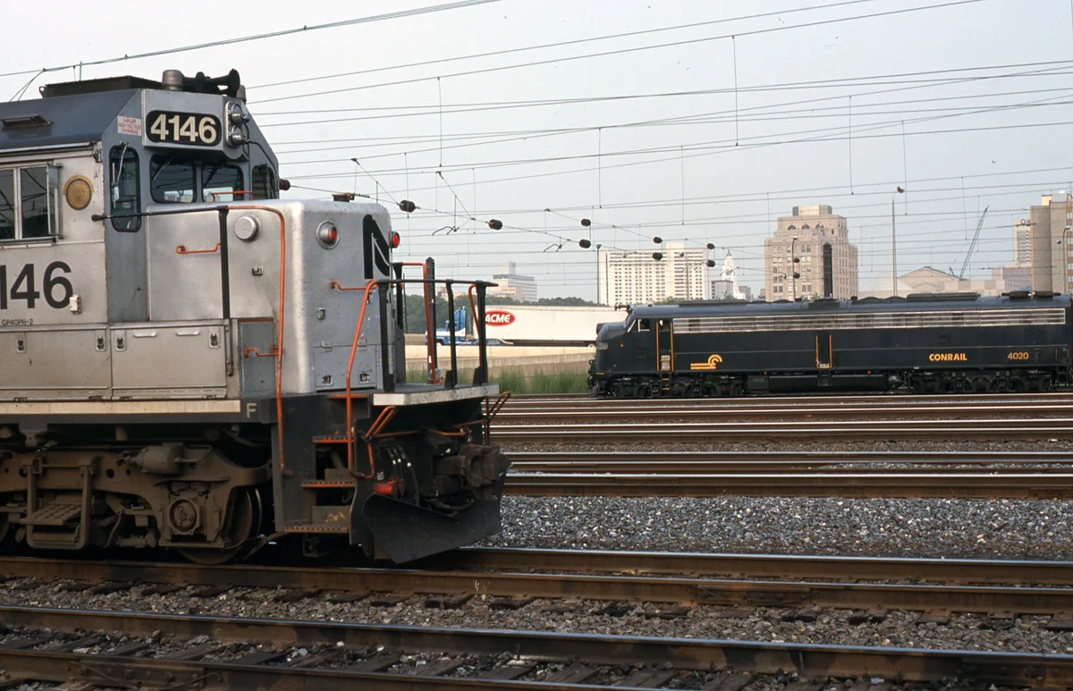CR 4020 a former Pennsy E8A, one of two that would go on to be restored by Bennett Levin's Juniata Terminal Company shares company with NJT GP40PH-2 No. 4146. This former GP40 locomotive that was actually rebuilt by Conrail's Juniata Shop in 1993 in a program for NJT. The photo was taken within Penn Interlocking located on the north side of 30th Street Station.