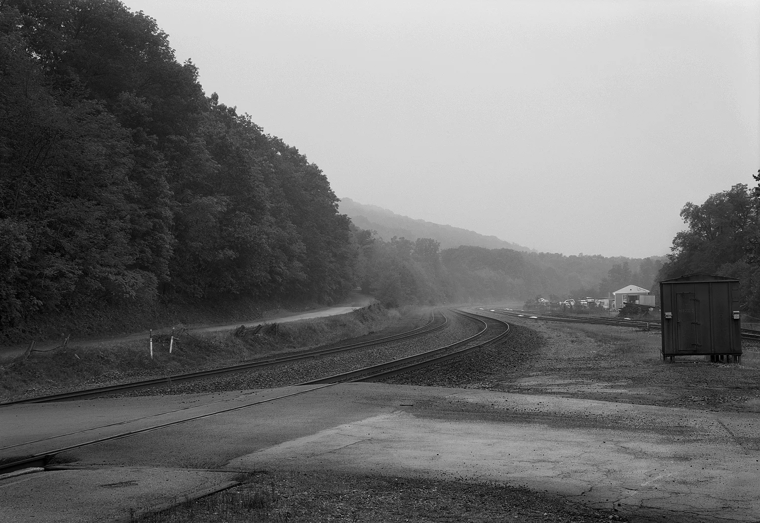 Just West of the of the former PRR Tyrone train station and current Amshack the Mainline made a sharp turn South heading down the Valley to the well know City of Altoona. This simple study looks across Spruce St and the Mainline at dusk in September of 2008. To the right is the yard trackage and connection to the Bald Eagle Branch, a line that provided a alternative route to the Mainline and access to the Upper Susquehanna Valley.