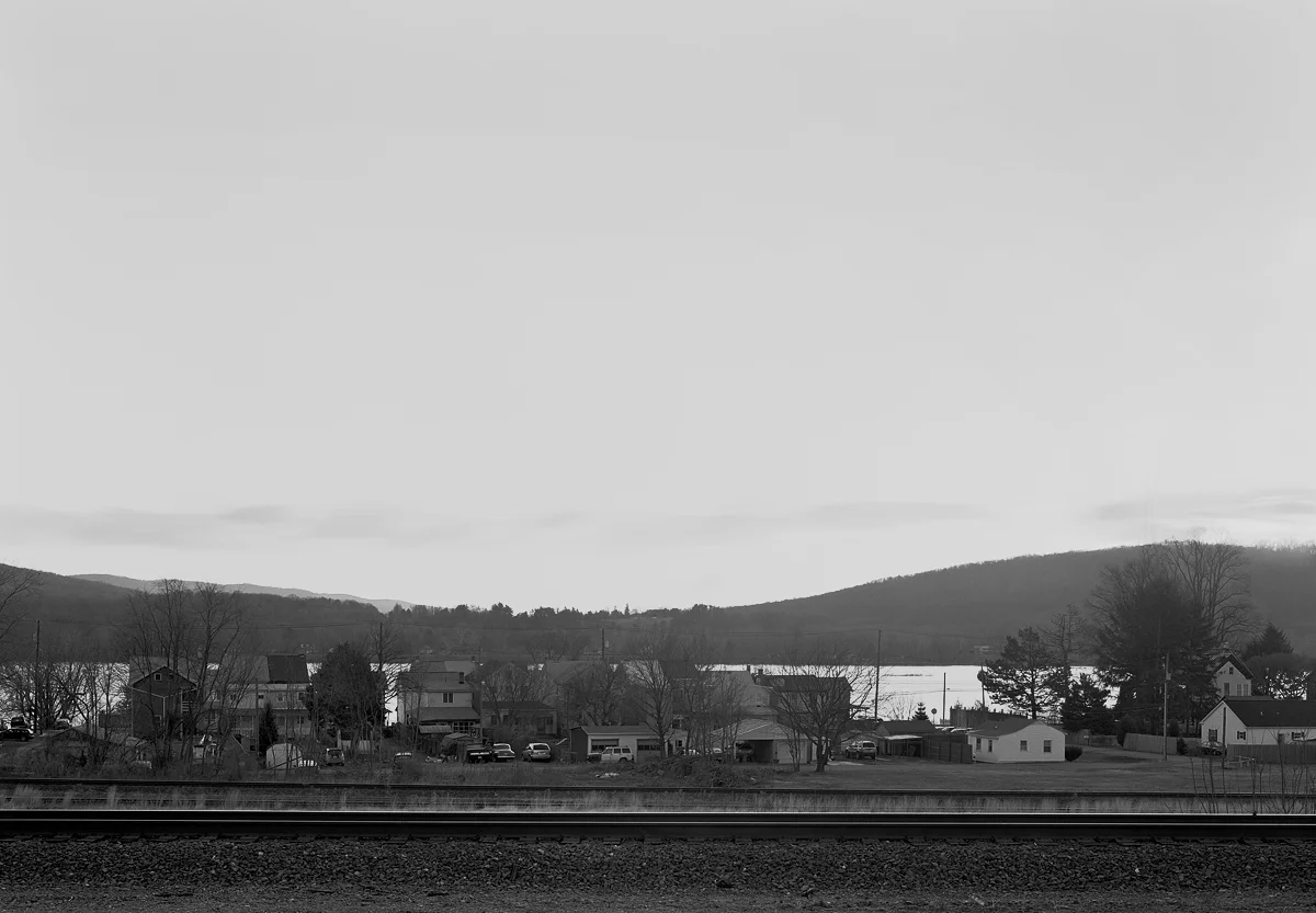 View of mainline tracks in immediate foreground and distant background. The space in between is the running tracks that connect from Enola Yard to Banks Tower in Marysville about a mile to the west (left). This area was also the original site of the Northern Central's freight terminal, and later auxiliary yard to Enola, used primarily to handle and reverse trains off the Williamsport Line prior to the 1939 installation of the "B track" to facilitate moves from the east directly into Enola.