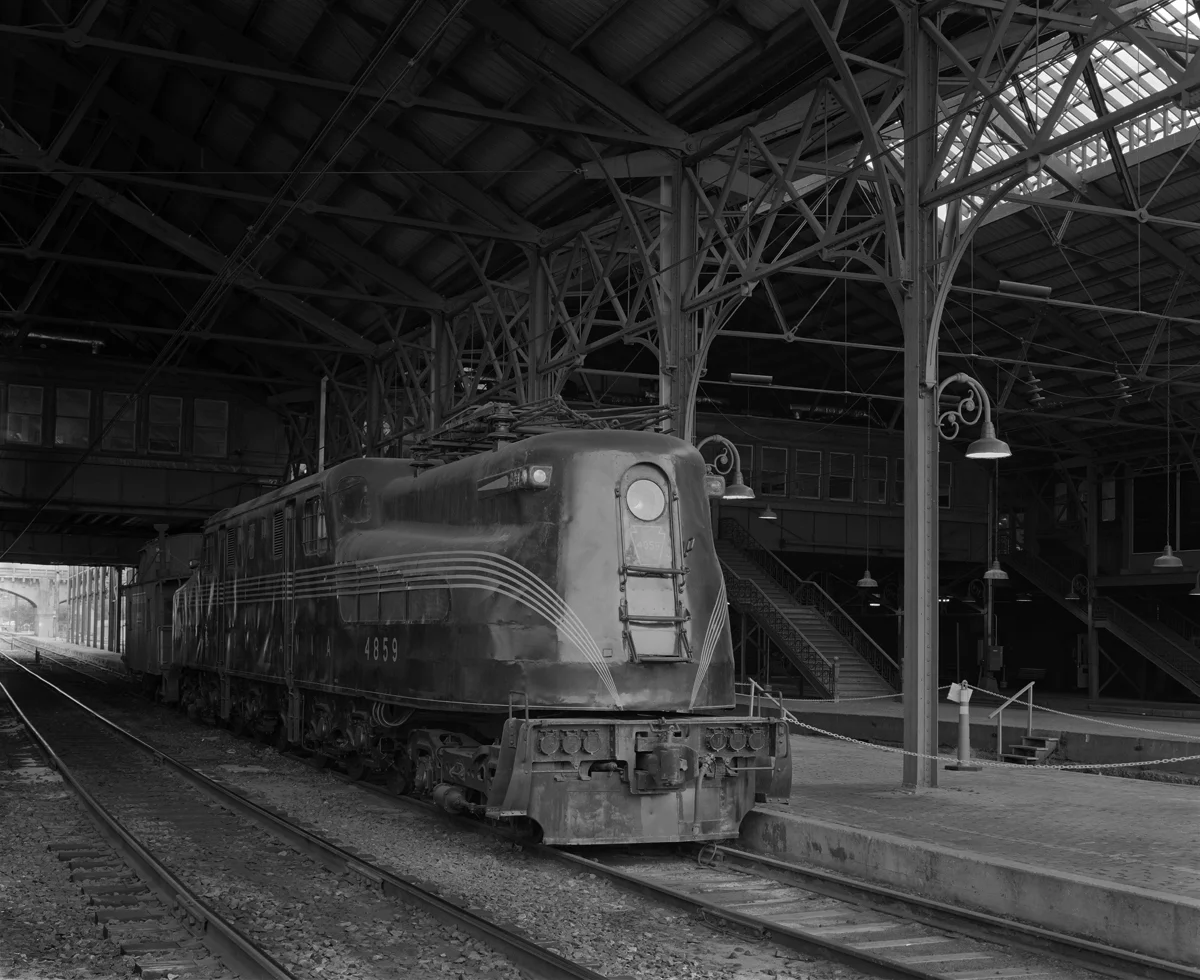 Situated on the former #5 Station track, PRR class GG-1# #4859 resides as part of a permanent display owned and maintained by the Harrisburg Chapter of the National Railway Historical Society, also accompanied by a class N6b PRR Cabin Car (caboose to non-PRR people). The 4859 is of particular significance to Harrisburg as it hauled the first scheduled electric powered passenger train into the station in 1938. The locomotive was part of a fleet of 140 locomotives built by both the PRR in Altoona and General Electric, the ubiquitous G, was the workhorse of both the limiteds, regional and local passenger/ mail trains as well as freight on the PRR. The last operational GG-1 ran in October of 1983 and 16 survive around the US as static displays.