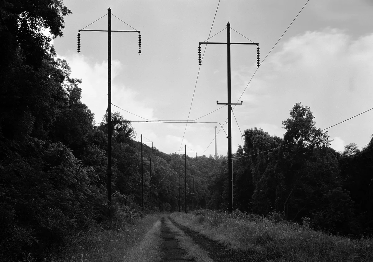 The former A&S right of way climbing toward Turkey Hill is one of two lines that round the point at different elevations. The Columbia and Port Deposit is at a lower elevation to the right, along the Susquehanna’s east bank. Note the wind turbine in the distance, the absence of the fan blade is due to the longer exposure while the turbine was in motion.