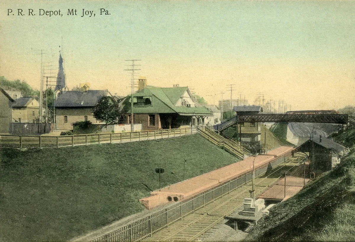 Turn of the century view of the third and final Mount Joy station after the PRR relocated the main line during the system improvements program of the 1890's. Inset image of the 1876 station constructed by the PRR on the original Harrisburg, Portsmouth, Mount Joy & Lancaster Railroad alignment at Market Street. Inset image collection of the Lancaster Historical Society.