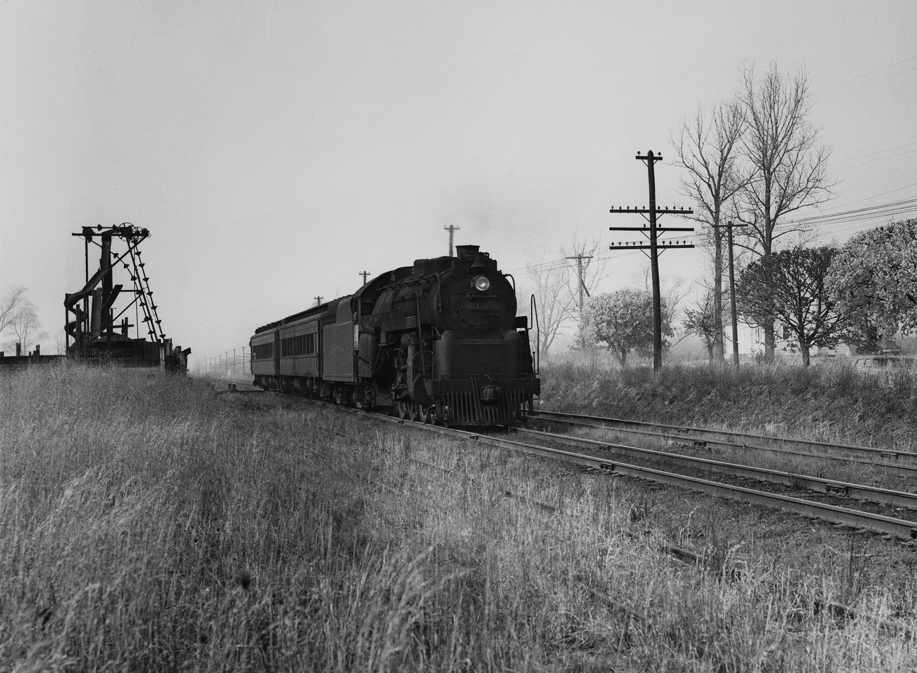 An off season Camden to Hammonton local running via the former Atlantic City Railroad main line crosses Vasser Ave in Stratford, New Jersey, December 6th, 1952. In short time the PRSL will remove the second main track on this line reflecting the diminishing train service on the secondary main line to Atlantic City. Photography by Robert L. Long, Collection of William Gindhart