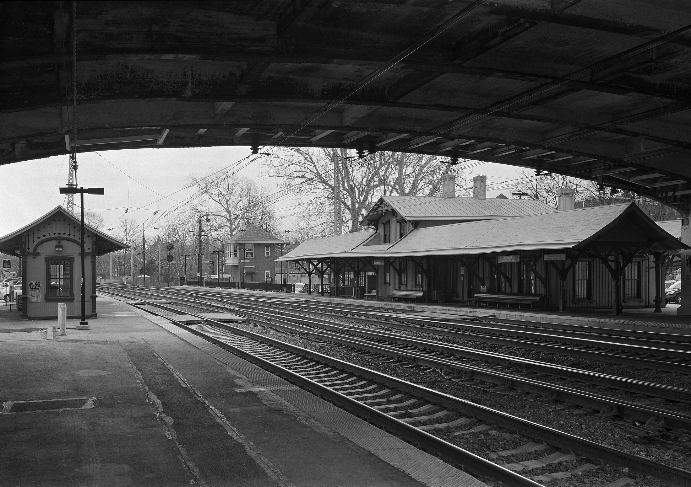 Overbrook Station marks the location where the Pennsylvania Railroad crosses from the Philadelphia city line into the suburban district knows locally as the Main Line. This location is full of PRR character including the station built in 1860, a PRR standard design interlocking tower and the original details from the first phase of the PRR's great electrification project. 