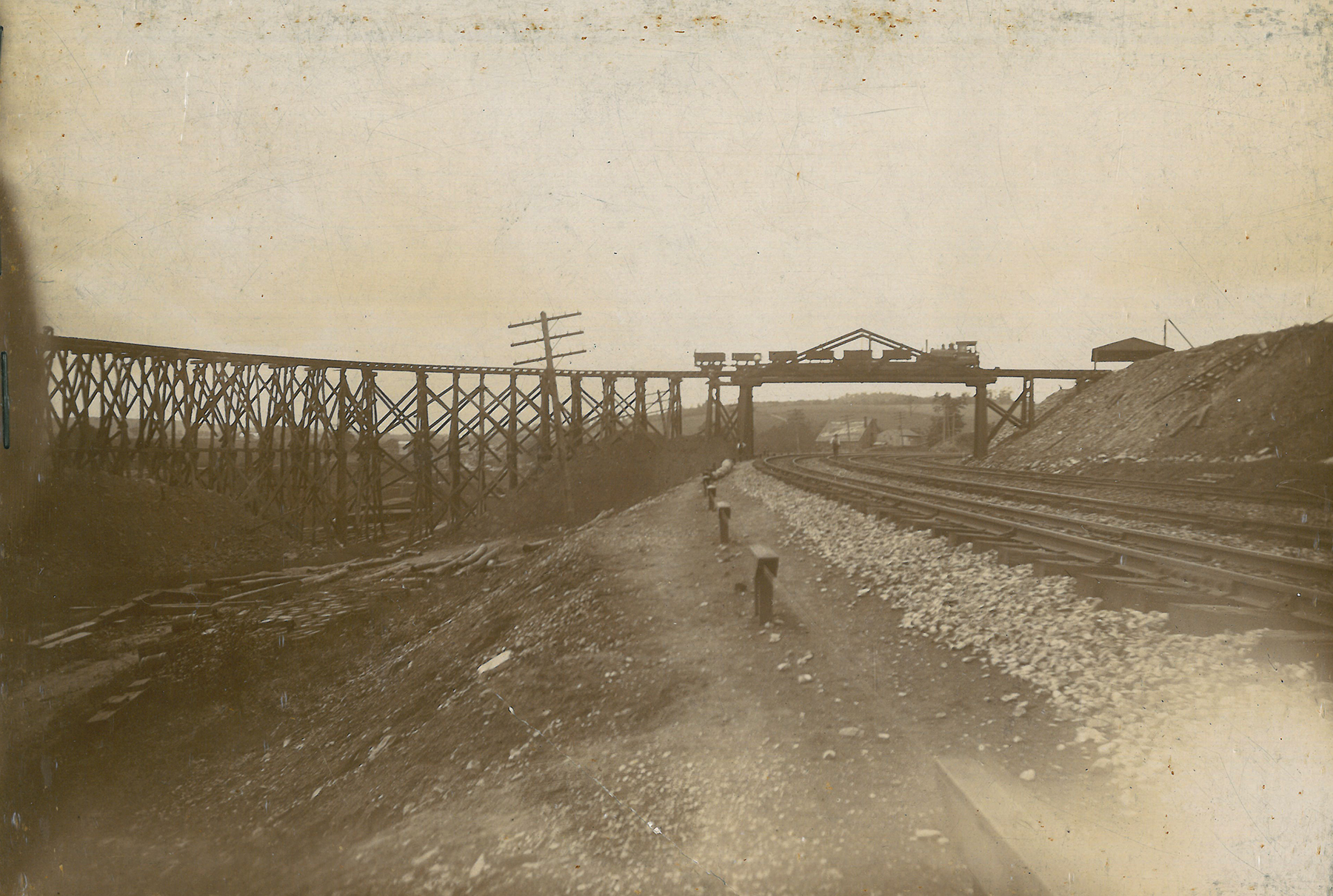 Charles Sims & Co, the contractor, tasked to construct the first seven miles of the A&S Branch erected this narrow-gauge railroad between an area near Zion Hill and the new Low Grade. The temporary line hauled material stored on local land holdings to the new elevated right of way, which required massive amounts of fill to maintain a gentle grade across the undulating landscape of Southern Lancaster County. Moores Memorial Library, Christiana, PA.