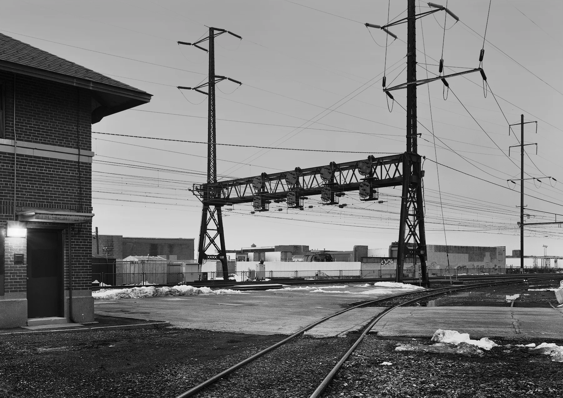 View of the westbound home signal, from the Bustleton Branch, Holmesburg section, Philadelphia, Pennsylvania. Holmesburg was an interlocking and commuter station along the main line and the location where the Bustleton Branch diverged. Countless locations alongside the railroad have a backstory, Photographs & History expands beyond the contemporary photograph to tell these stories. 