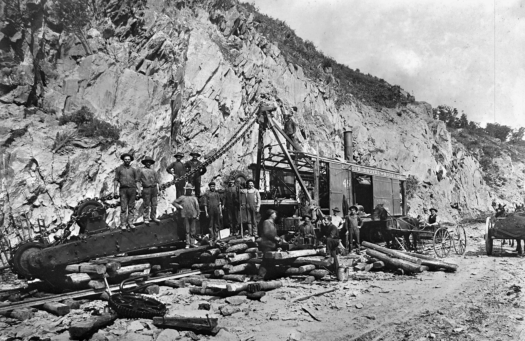 An excavation crew pauses with a rail mounted steam shovel that appears to be down for repairs. Steam shovels and air powered drills were initially utilized to excavate the right of way in Manor township as well as the deep cuts along the line to the east. Kline Collection, Railroad Museum of Pennsylvania, PMHC