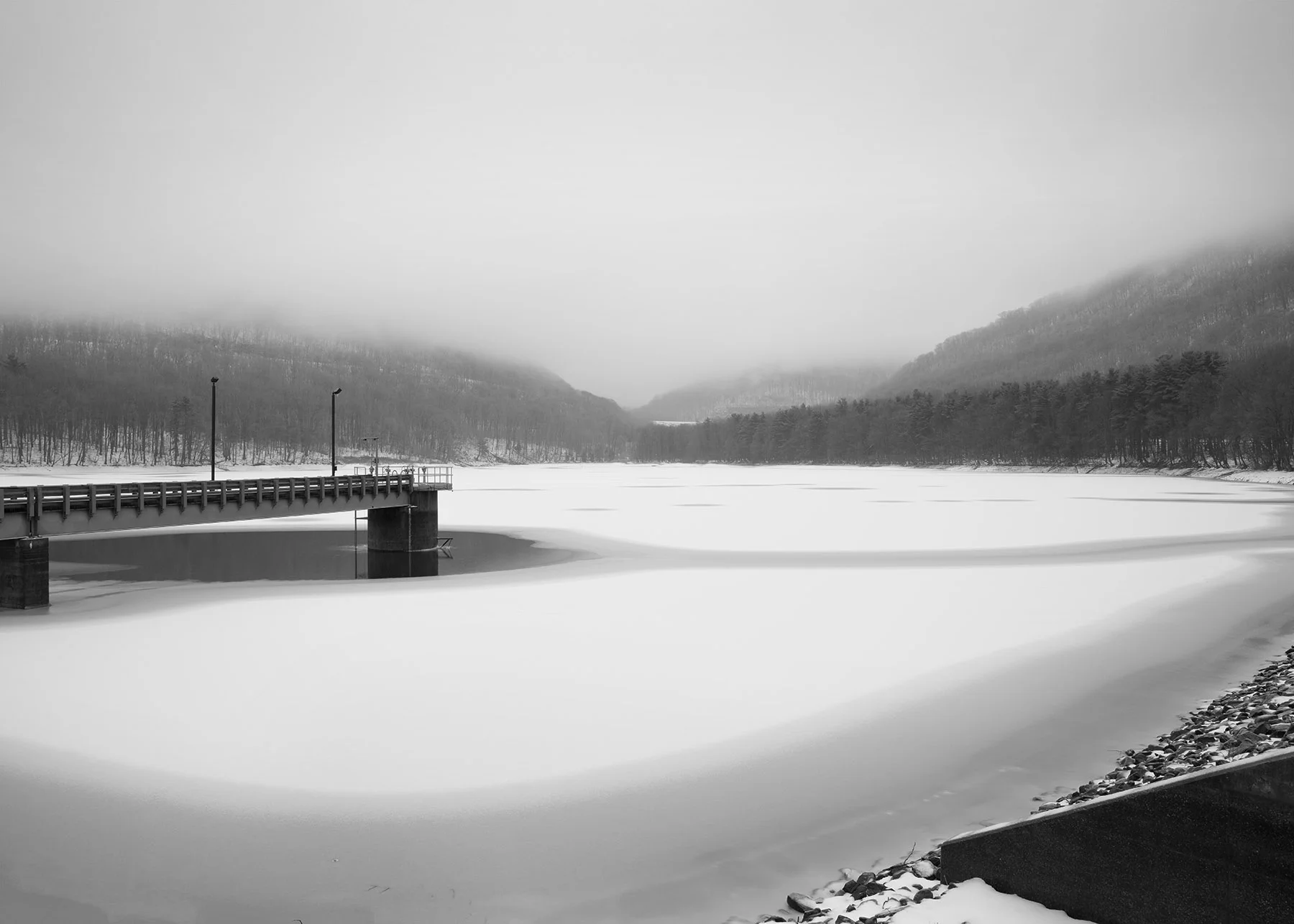 The Kittanning Reservoir occupies the gap created by Burgoon Run, where J. Edgar Thomson was faced with a decision of spanning the gap or filling the smaller Glen White and Kittanning Runs. The purpose of utilizing the horseshoe design is evident in the elevation changes of the railroad, visible above the gap along the left and right hillsides. 