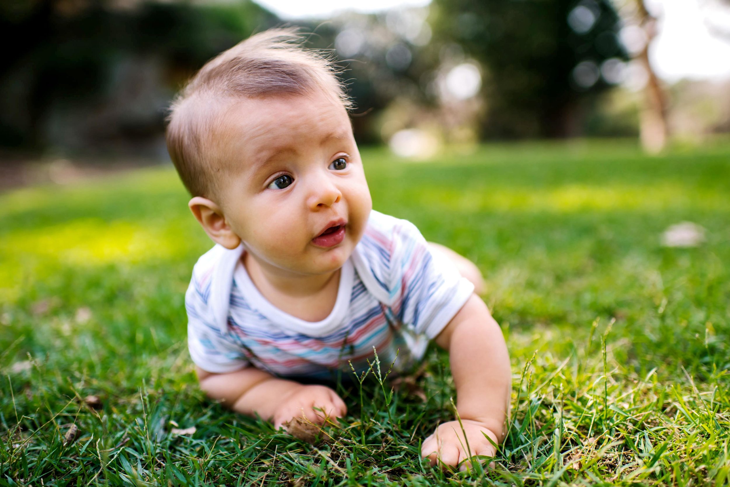 Baby lying on grass at Rosherville reserve park