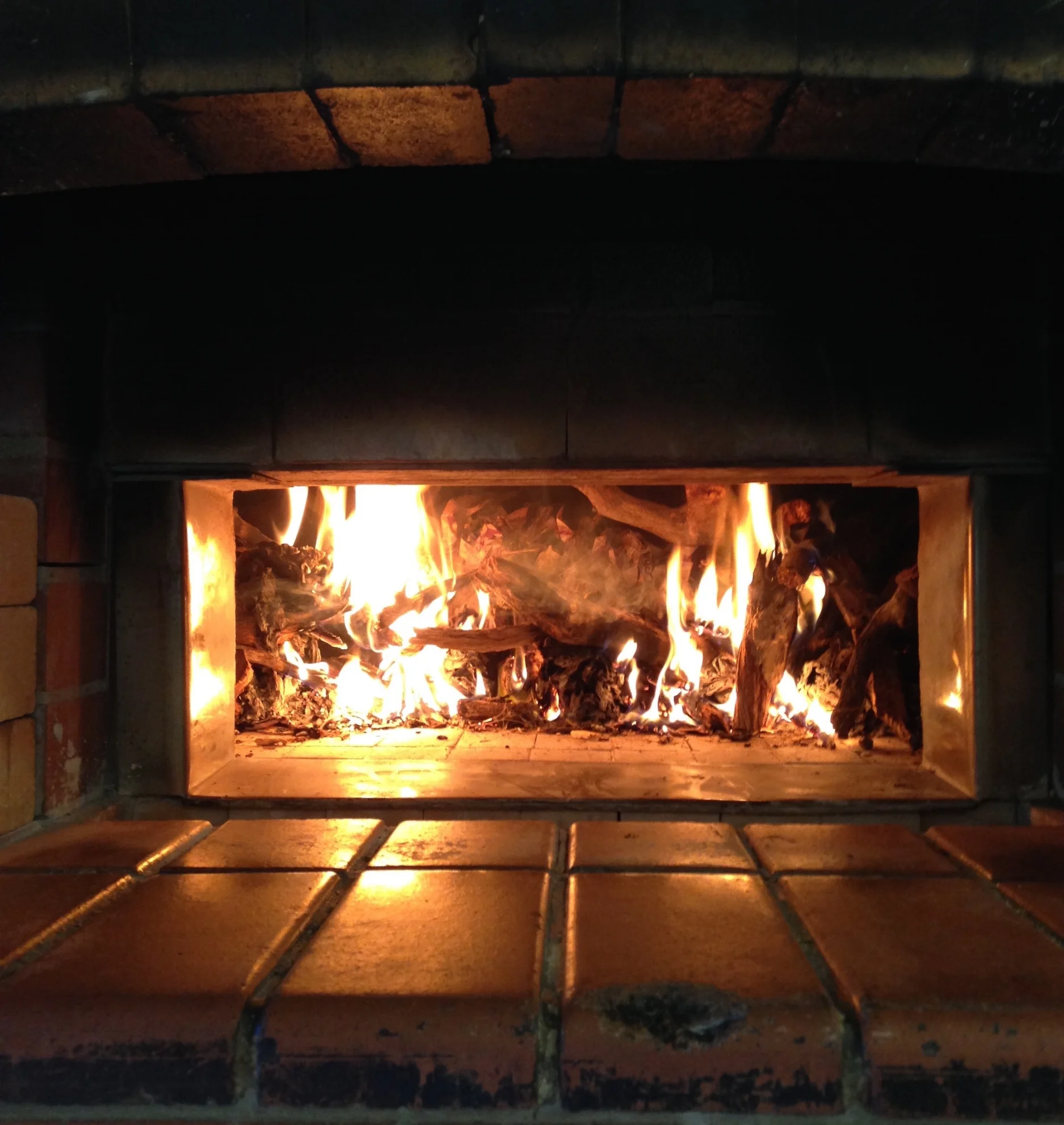 24 hours before we make the final dough, the oven is loaded with wood and lit.