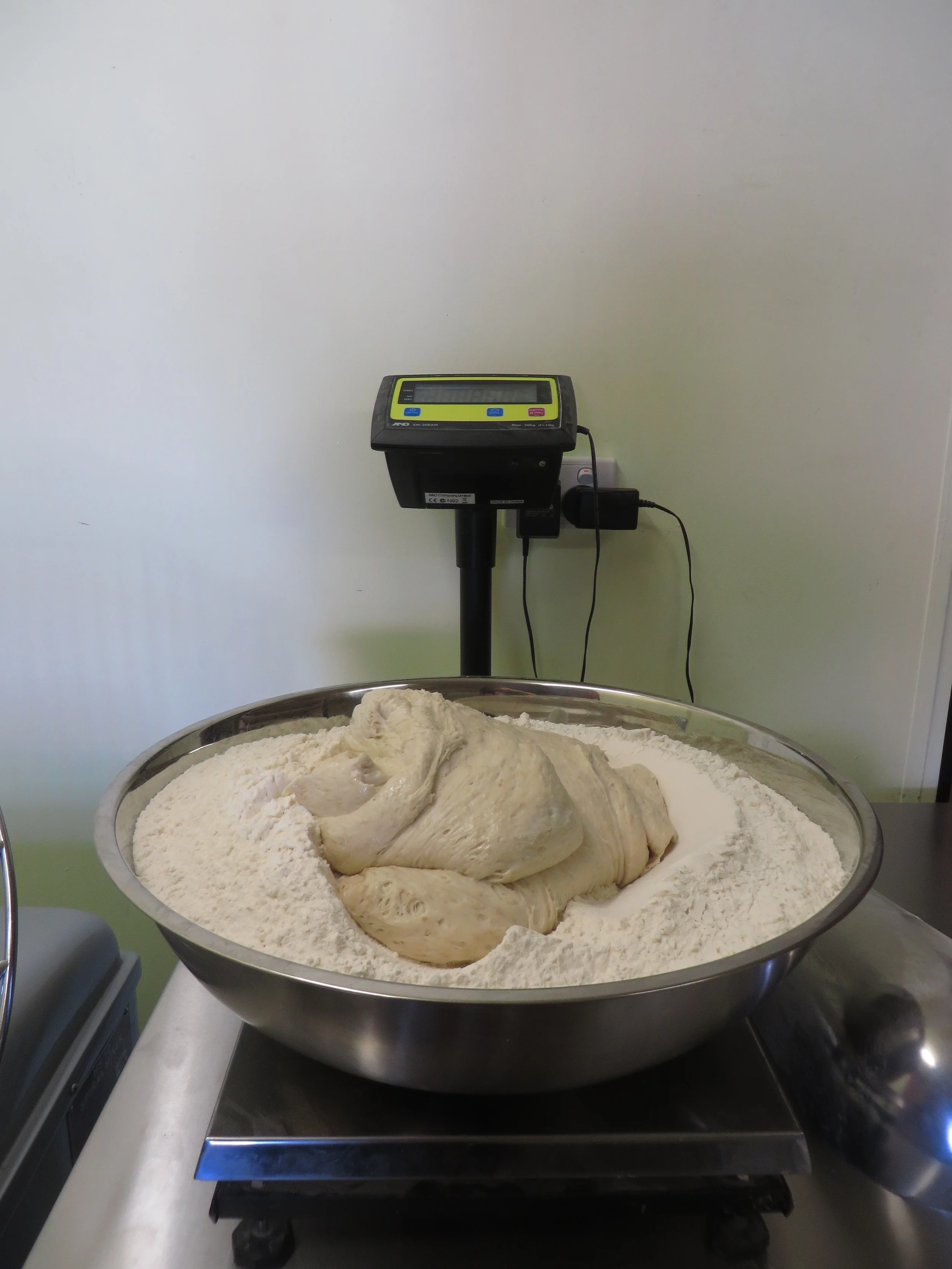 In the afternoon the final doughs are made using the mixer. The mixer combines ingredients and we use bulk fermentation to develop the gluten. The doughs are folded during this fermentation which adds strength and elasticity to the doughs. 