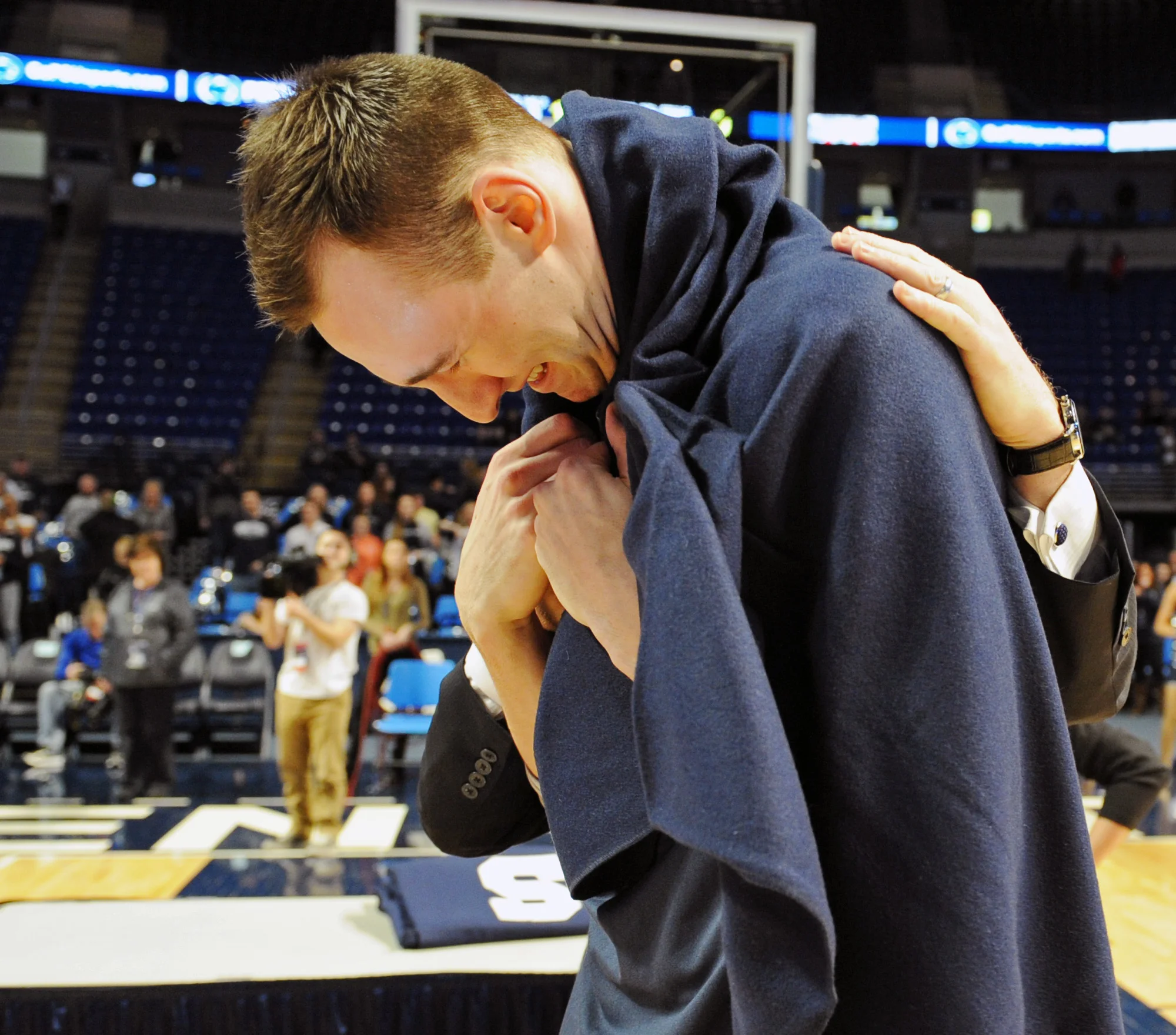 Senior forward Alan Wisniewski gets emotional after head coad Pat Chambers wraps him in a Penn State blanket during the Senior Day ceremony prior to the start of the game against Ohio State held at the Bryce Jordan Center on Wednesday, March 4 2015.