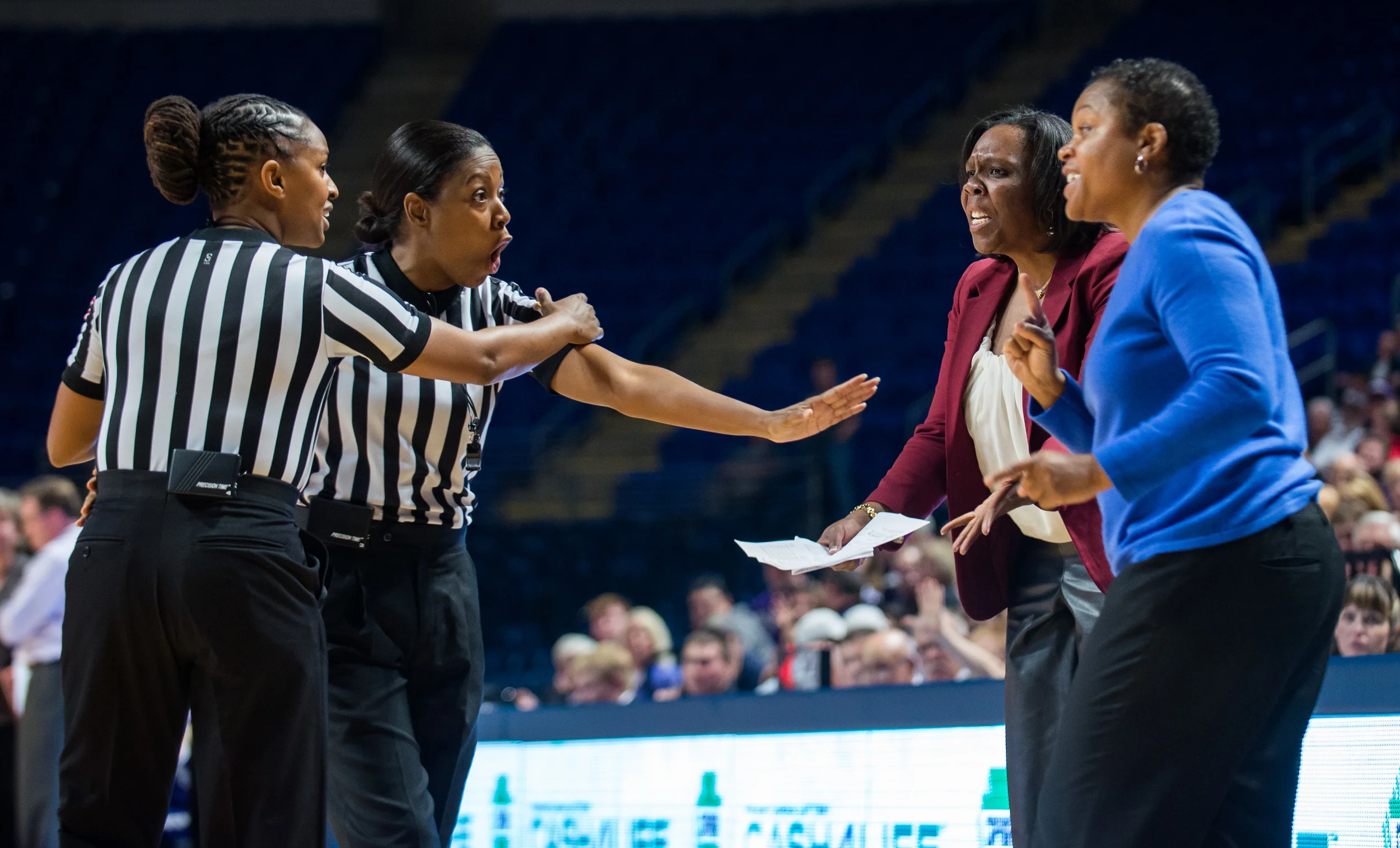 Head coach Coquese Washington and assistant coach Kia Damon argue with referees over a call during the women's basketball game against Holy Cross on Friday, Nov. 13, 2015.