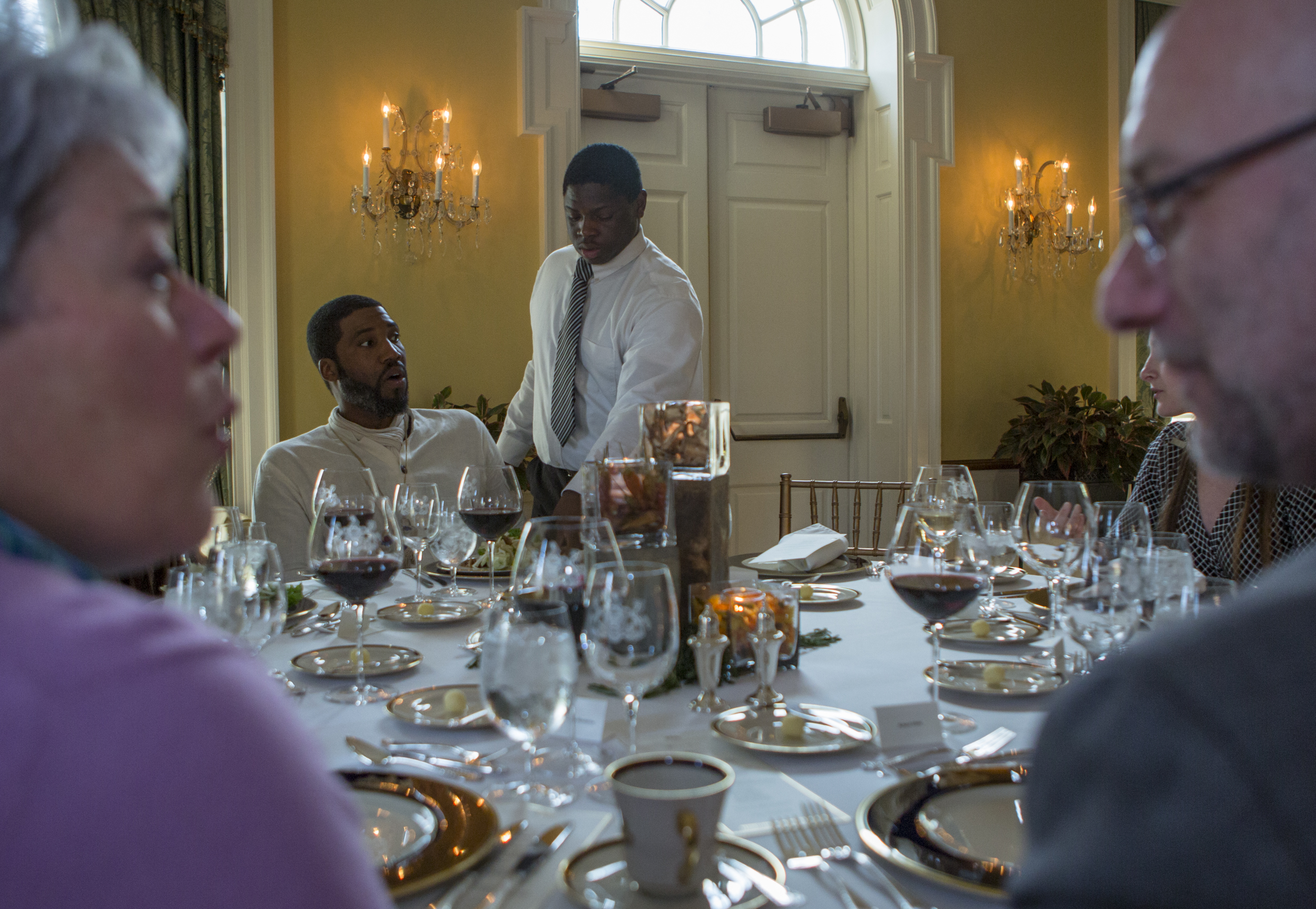 CPI culinary student Eli Lipscomb serves a salad to Penn State graduate student Eric Farmer as part of the dinner hosed by CPI students and staff at the Governor's Residence in Harrisburg on Monday, April 11, 2016.