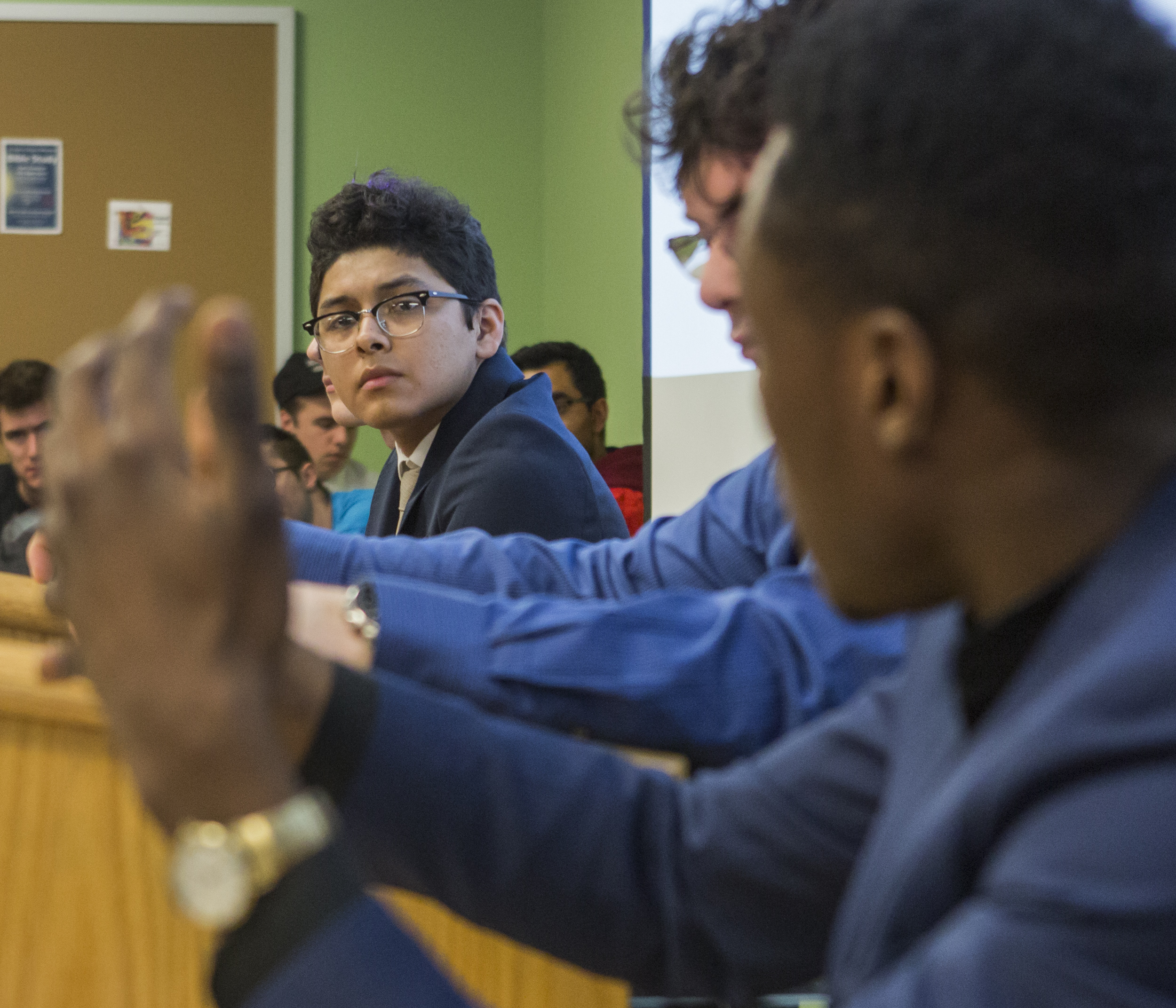 David Carcamo (freshman - international politics) listens to the rebuttal given by Jonathan Abu during the debate between Students for Trump and the Penn State NAACP chapter in the Willard Building on Wednesday, April 13, 2016.