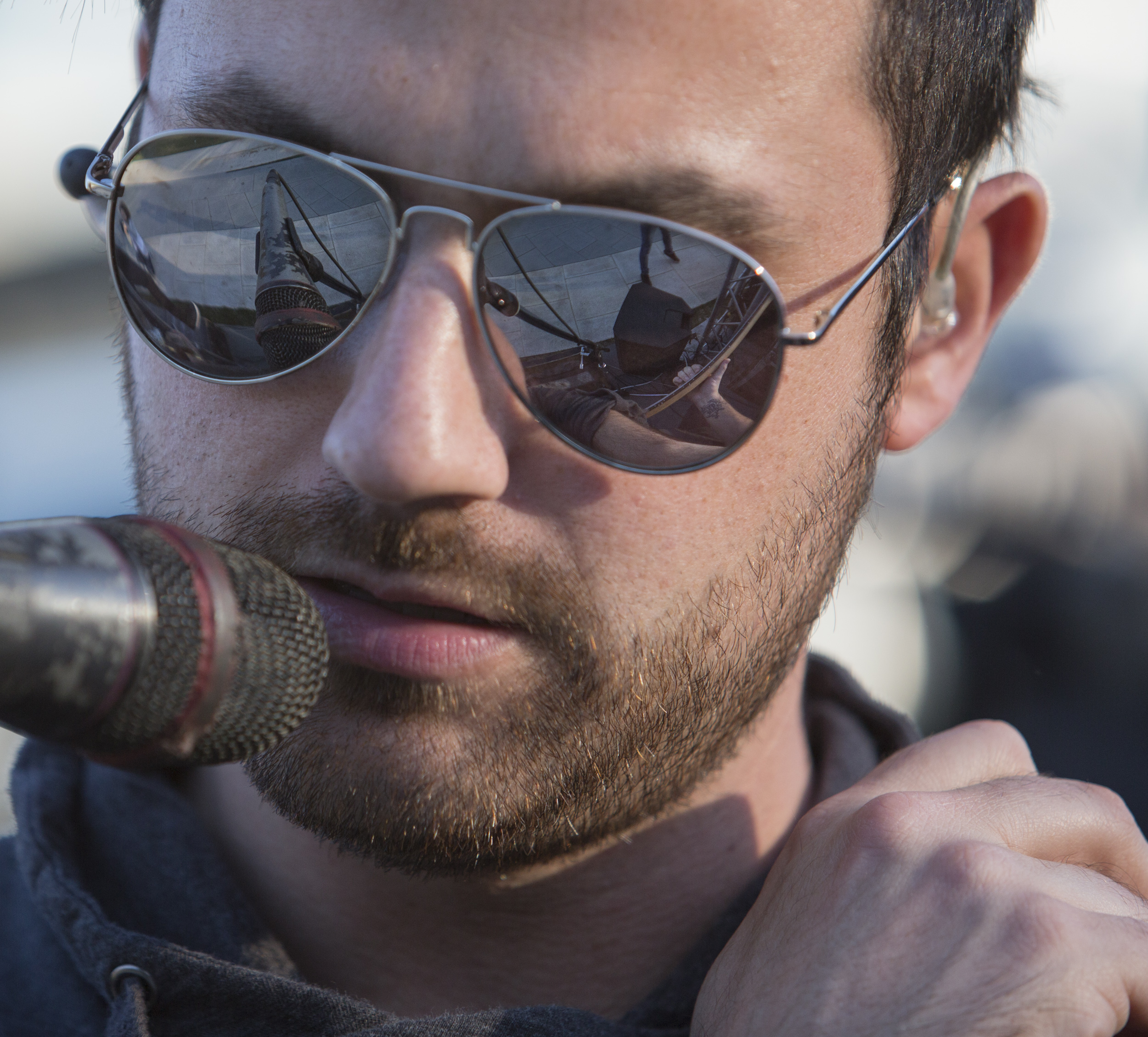 Bassist Nate Myotte glances down at his guitar during Go Go Gadjet's performance on the HUB lawn as part of PSiheartU week on Thursday, April 14, 2016.