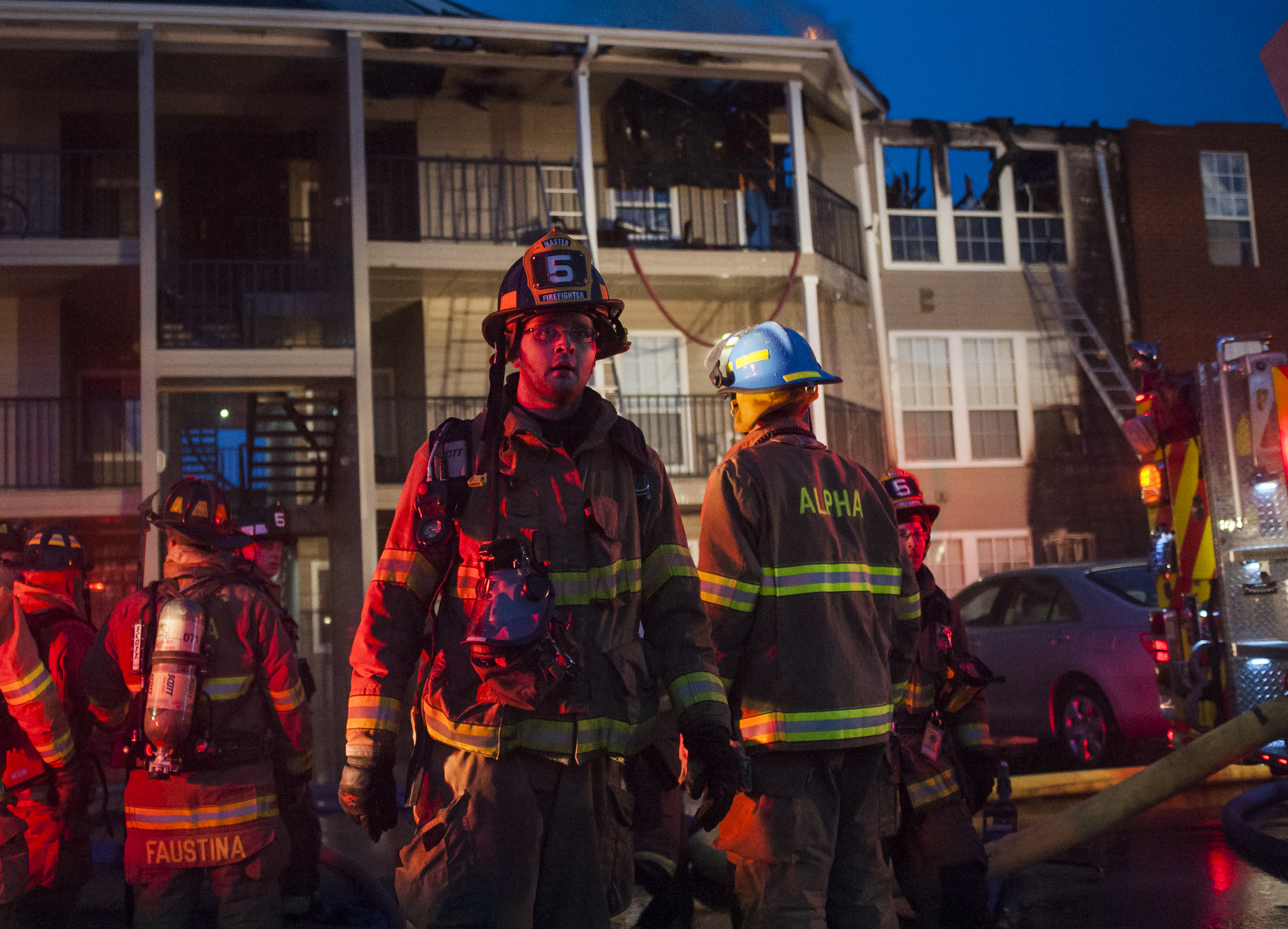 Members of Alpha Fire Co. work on extinguishing and clearing building 14 of The Park Apartments on Wednesday, April 20, 2016.