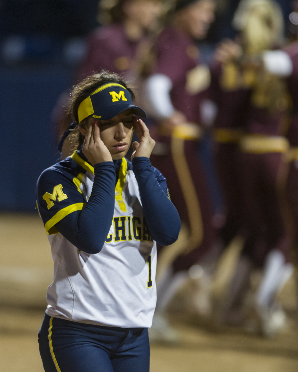 Michigan second baseman Abby Ramirez walks off of the field after the 4-3 loss to Minnesota in the bottom of the 10th inning of the final game of the Big Ten Tournament at Beard Field on Saturday, May 14, 2016.
