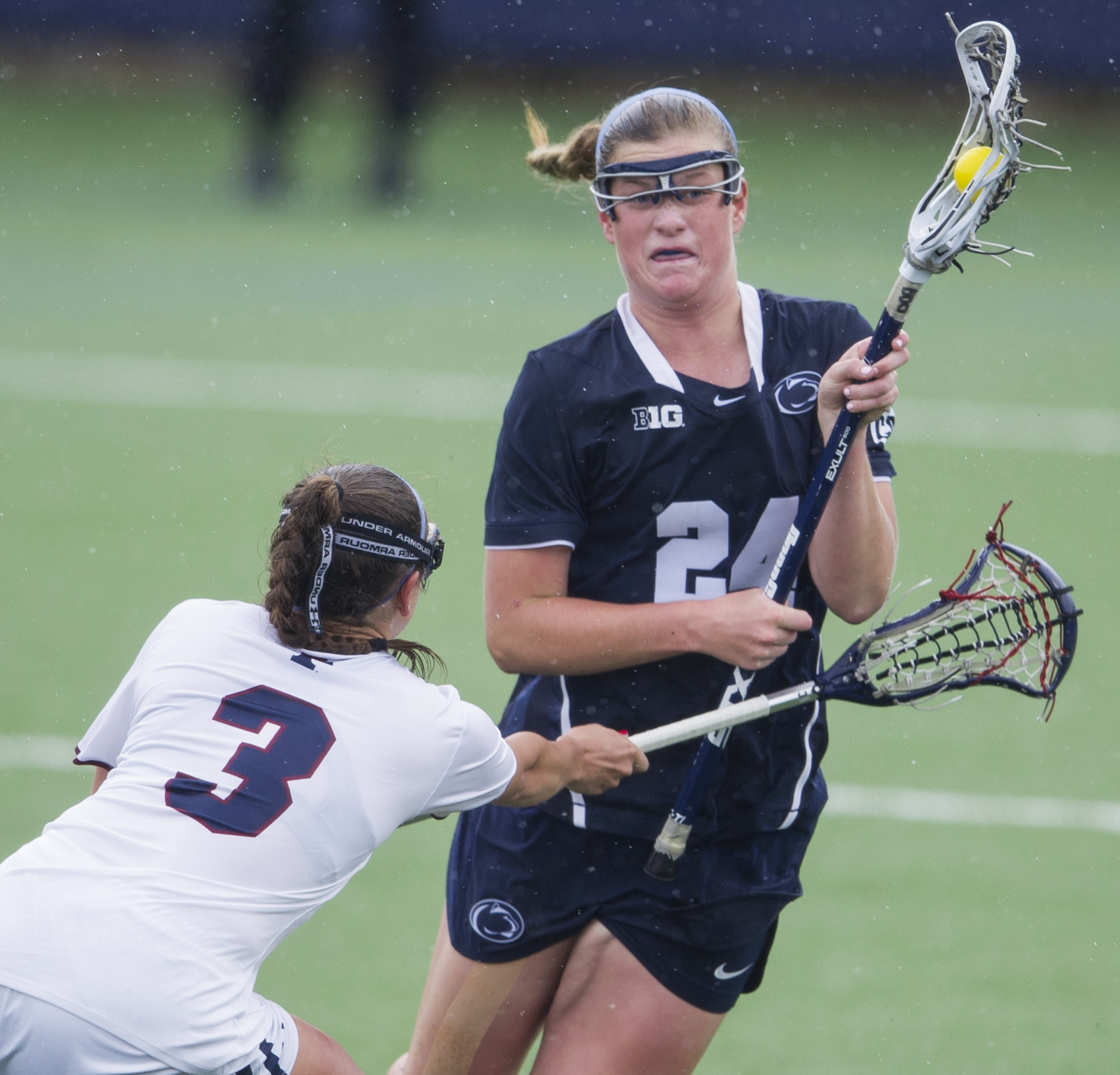 Penn State attacker Madison Carter charges the net while under coverage from Penn defender Katy Junior during the NCAA quarterfinal game at the Lacrosse Stadium on Saturday, May 21, 2016. Penn State won the game 8-4.