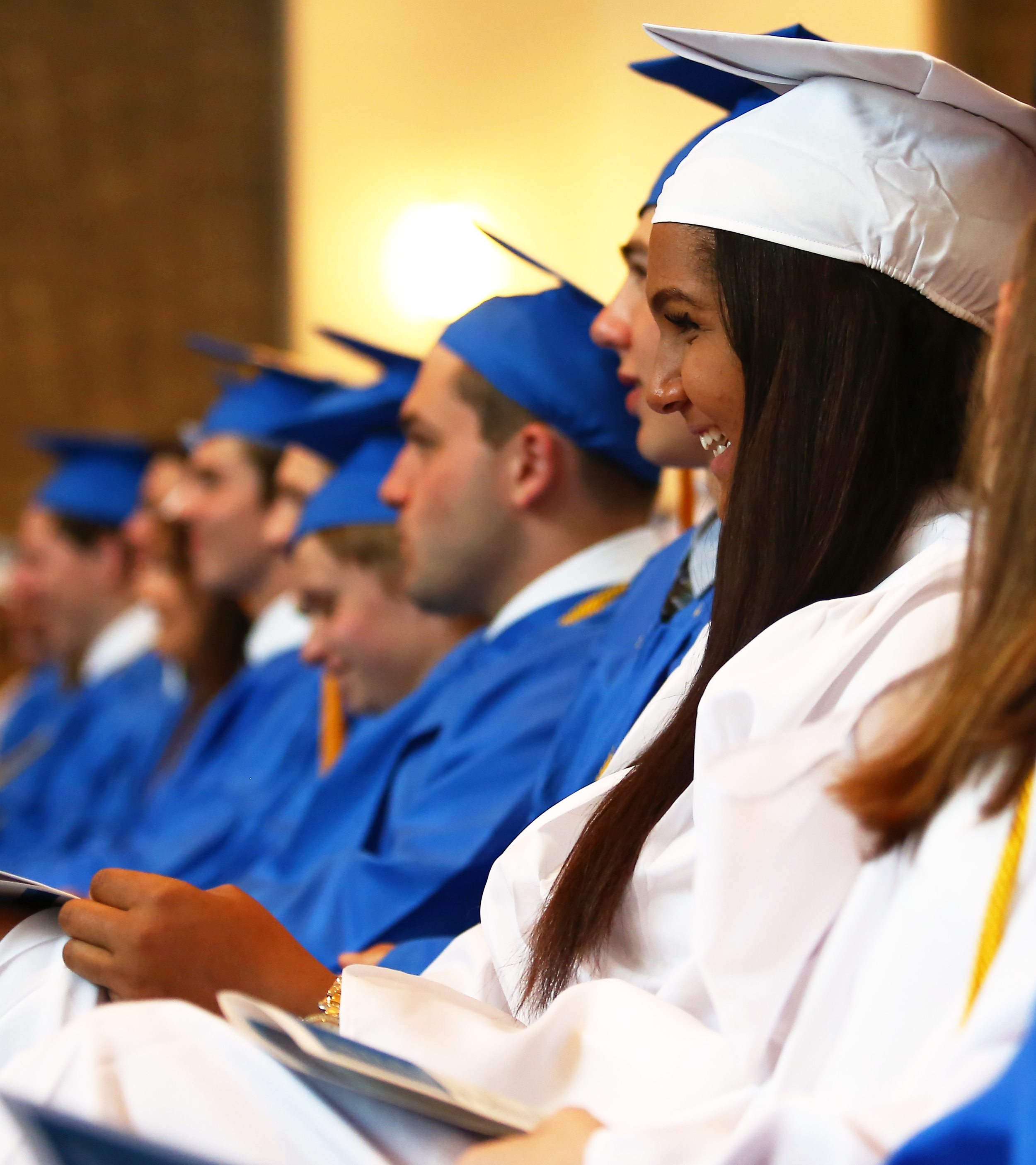 Members Saint Joseph's Catholic Academy's graduating class laugh at remarks from keynote speaker Dr. Christian Brady during the graduation ceremony at Pasquerilla Spiritual Center on Saturday, May 21, 2016.