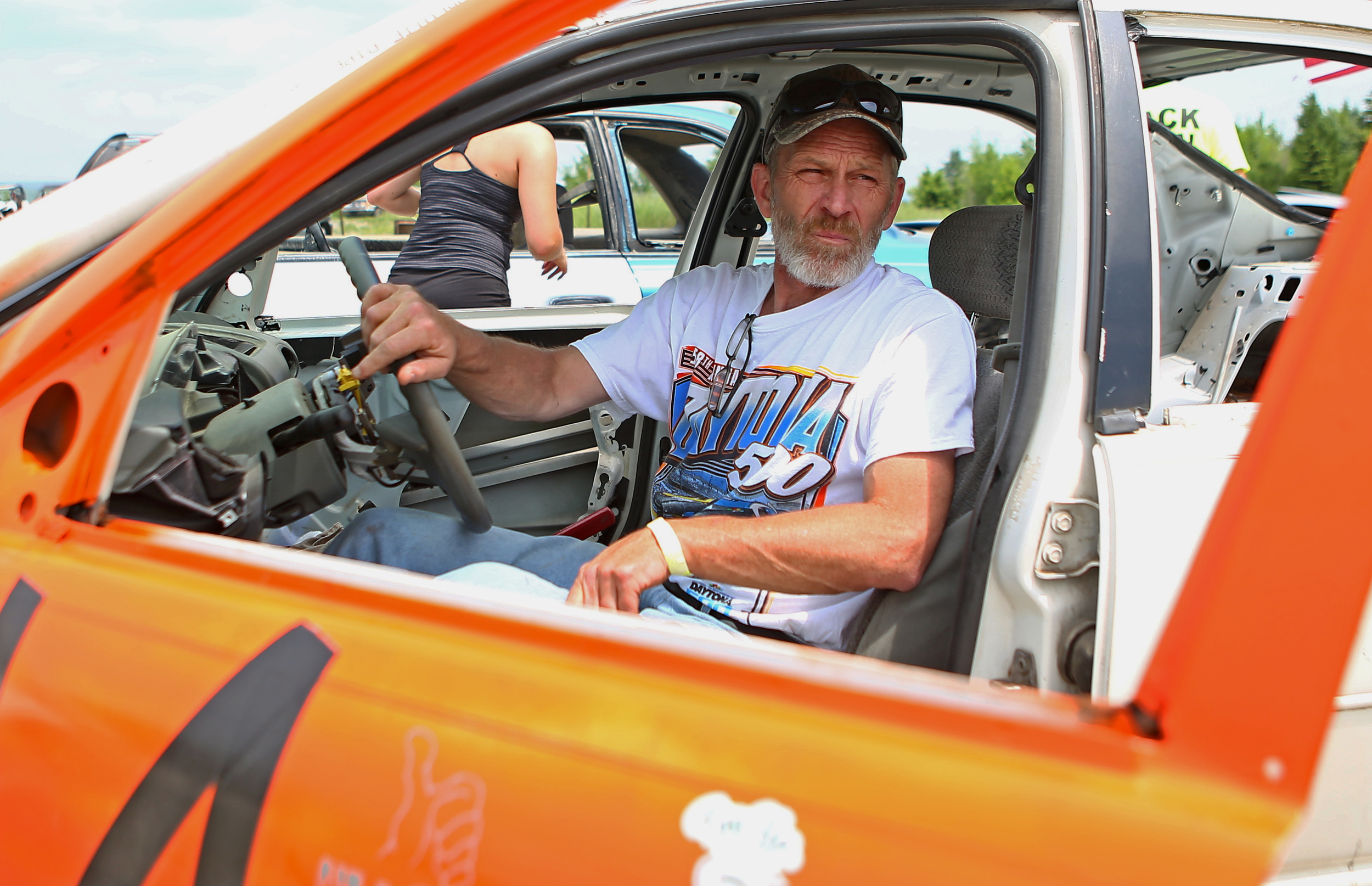 Mike Johnson sits in his modified Crysler after makings final preparations before his first race in the annual Snow Shoe Mud Race at the Snow Shoe Mud Track on Sunday, May 29, 2016.