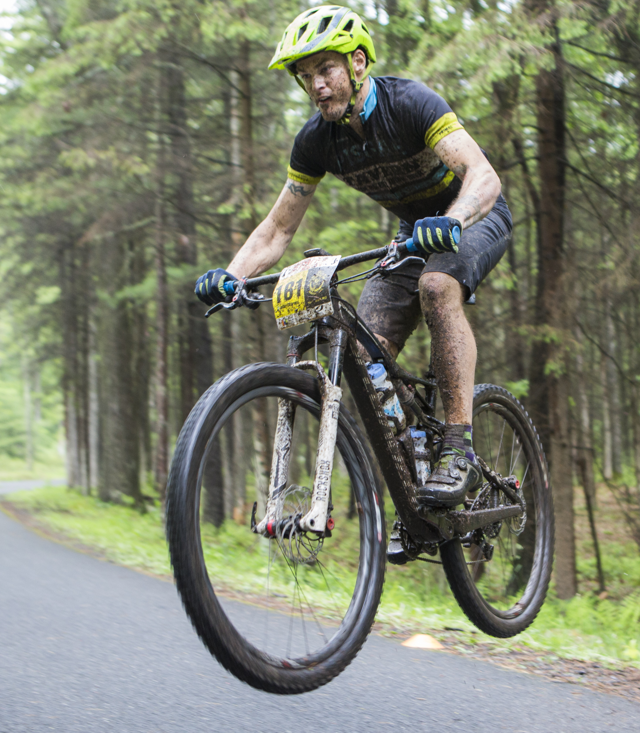 John Skarupa of the Cage Rage team catches some air on the road jump as part of the fifth enduro section of the fourth stage of the Tran-Sylvania Epic Mountain Bike Ride on Thursday, June 2, 2016.