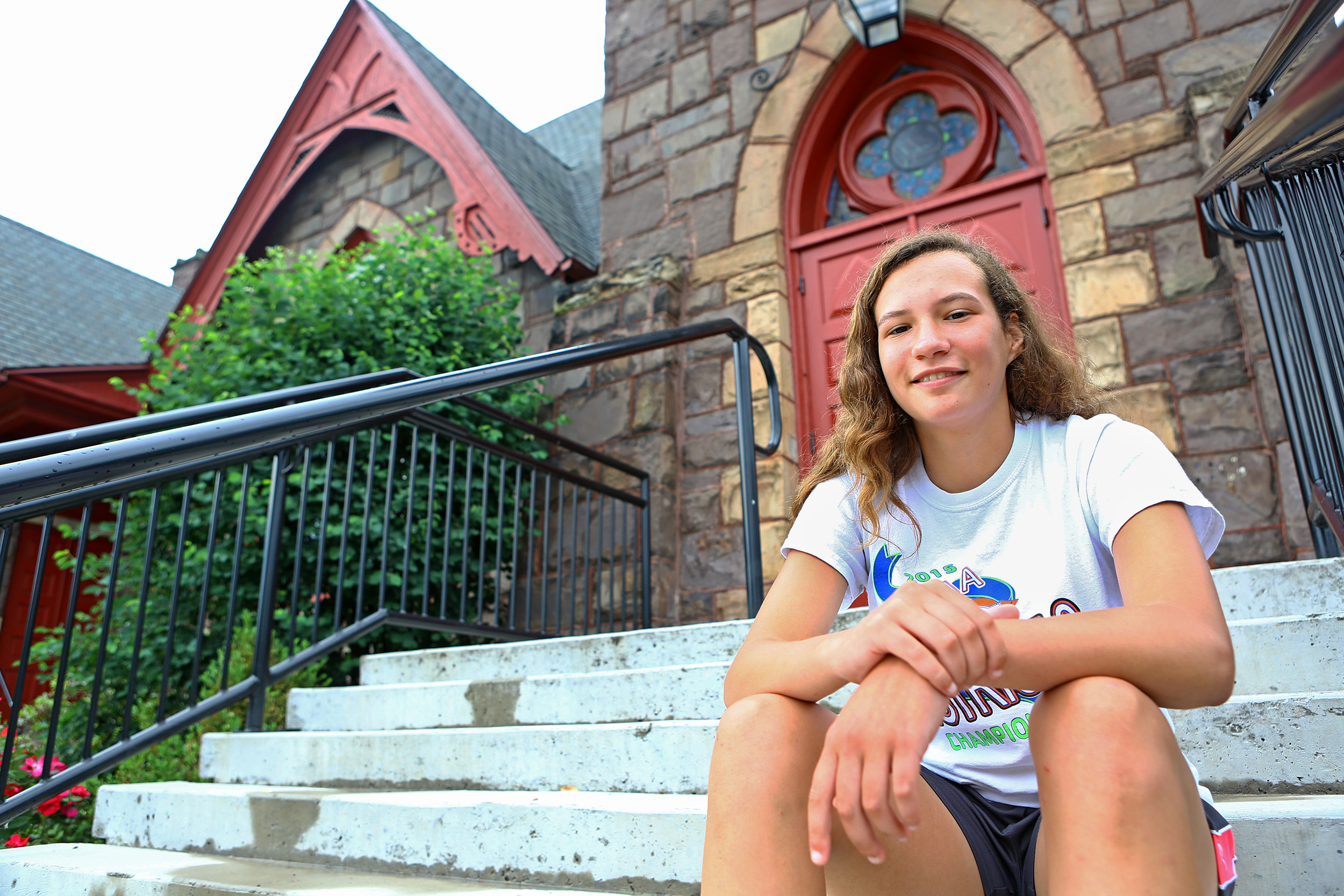 Penns Valley rising junior Alexis Witherite poses for a photo on the steps of Trinity United Church of Christ on Sunday, June 5, 2016. Witherite will be leading a mission group to Guatemala to build brick stoves and replant trees.