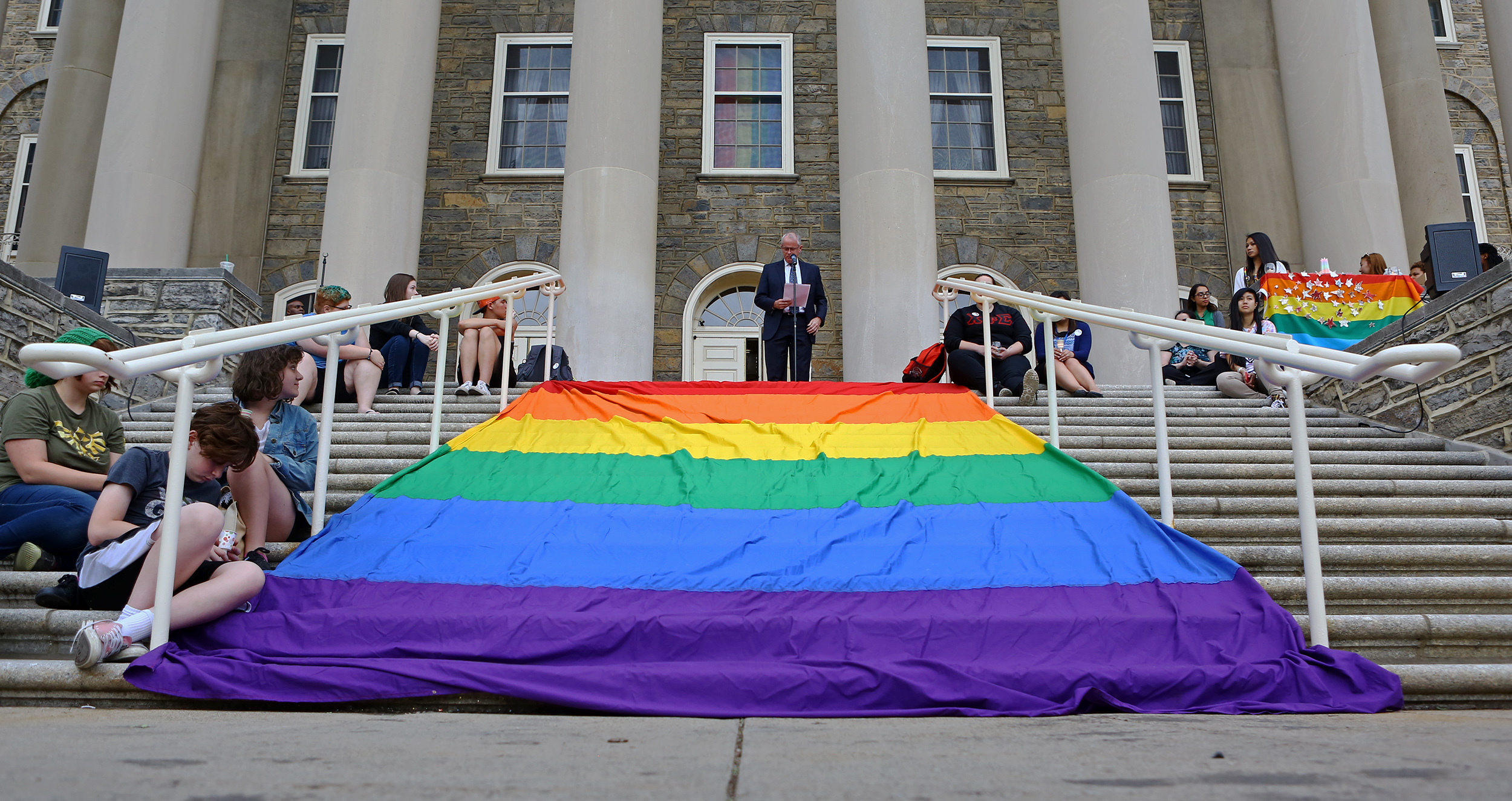 Penn State executive vice president and provost Nick Jones speaks on the steps of old main during the candle light vigil honoring the Orlando, Florida shooting victims on Monday, June 13, 2016.
