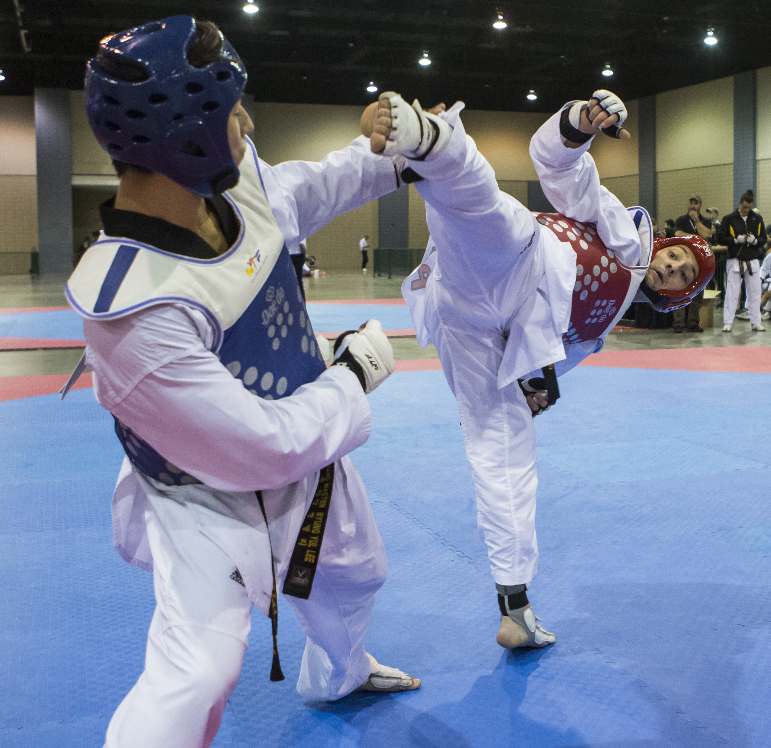 Travis Wissbroecke dodges a high kick from Matt Gallagher during a sparring match as part of the USA Taekwondo National Championships held at the Greater Richmond Convention Center in Richmond, Va. on Thursday, July 7, 2016.