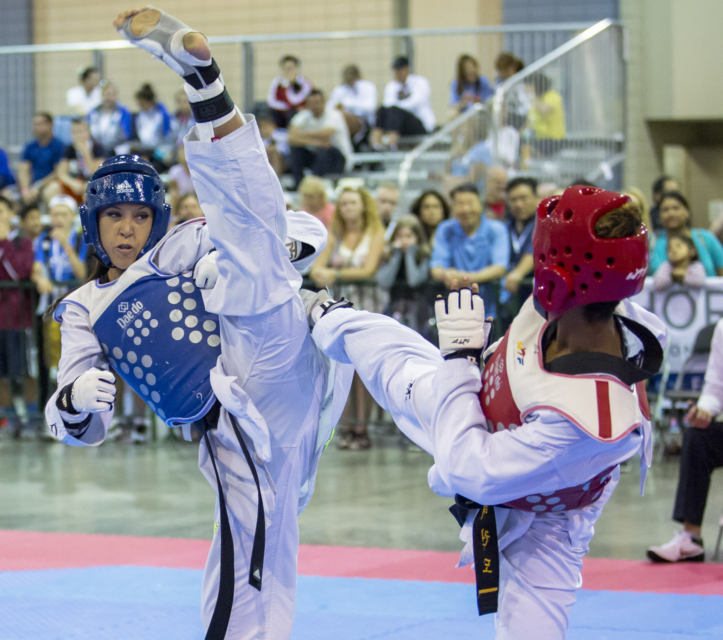 Cassie Tubbs extends for a high kick in her bout against Starla Santana during the USA Taekwondo National Championships held at the Greater Richmond Convention Center on Sunday, July 10, 2016.