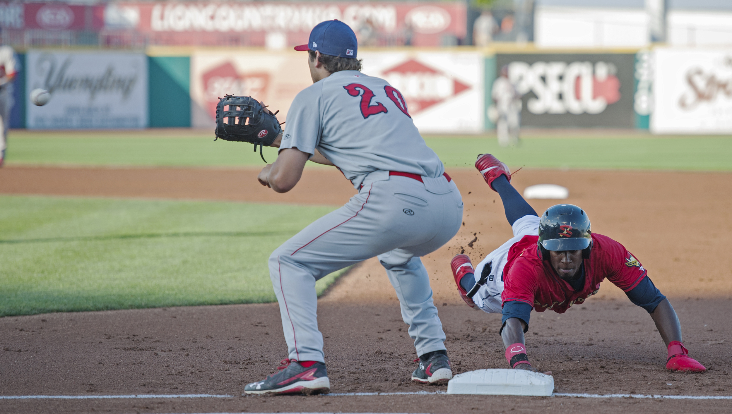 Auburn Doubledays first baseman Ryan Ripken turns to catch a throw from the pitcher as State College Spikes left fielder Vince Jackson dives back to first base after being caught trying to steal during the second game of their series at Medlar Field on Friday, July 22, 2016.