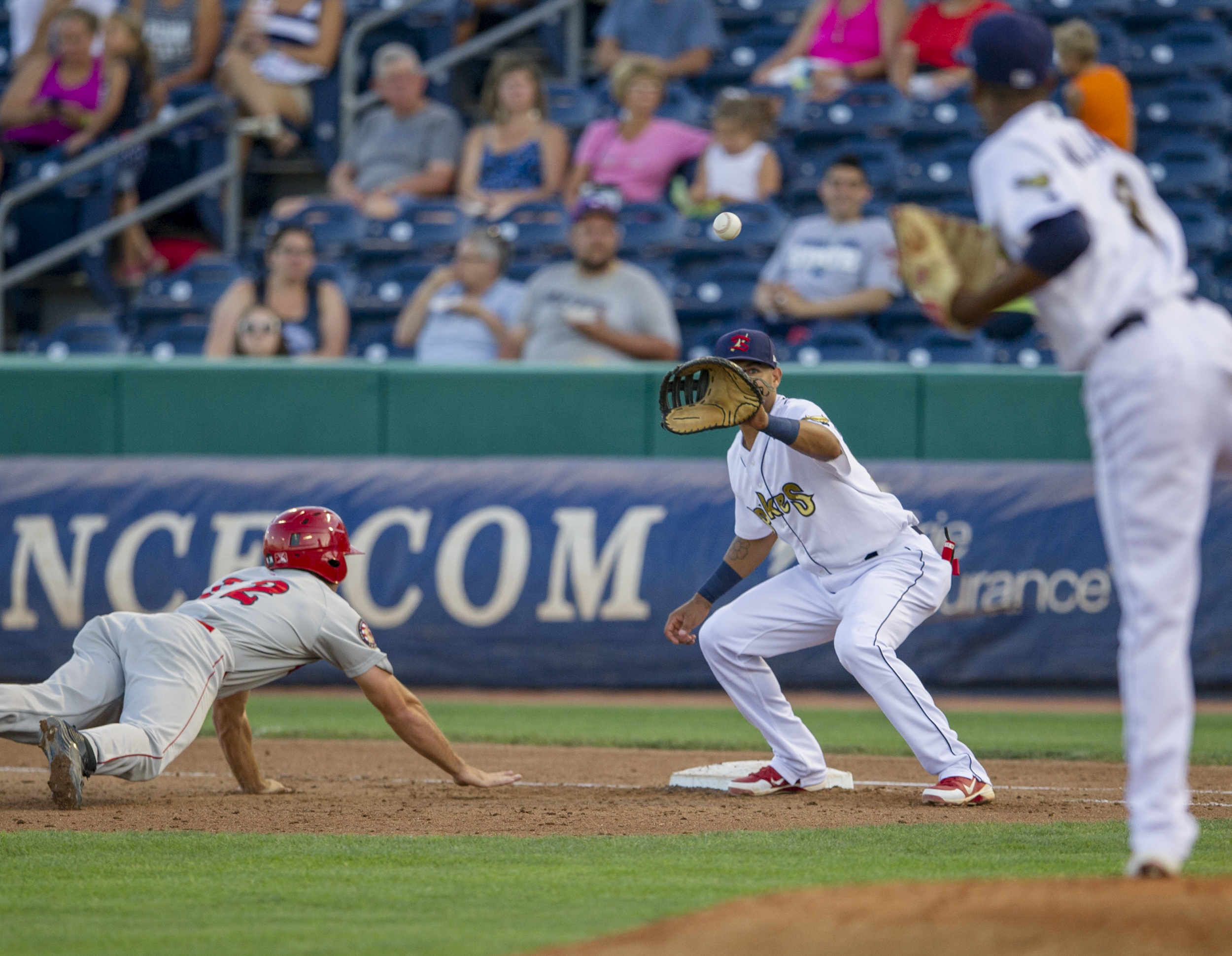 State College Spikes first baseman Ryan McCarvel catches a throw from pitcher Ronnie Williams after Auburn Doubledays third baseman Andres Martinez is caught trying to steal during the third game of their series at Medlar Field on Saturday, July 23, 2016.