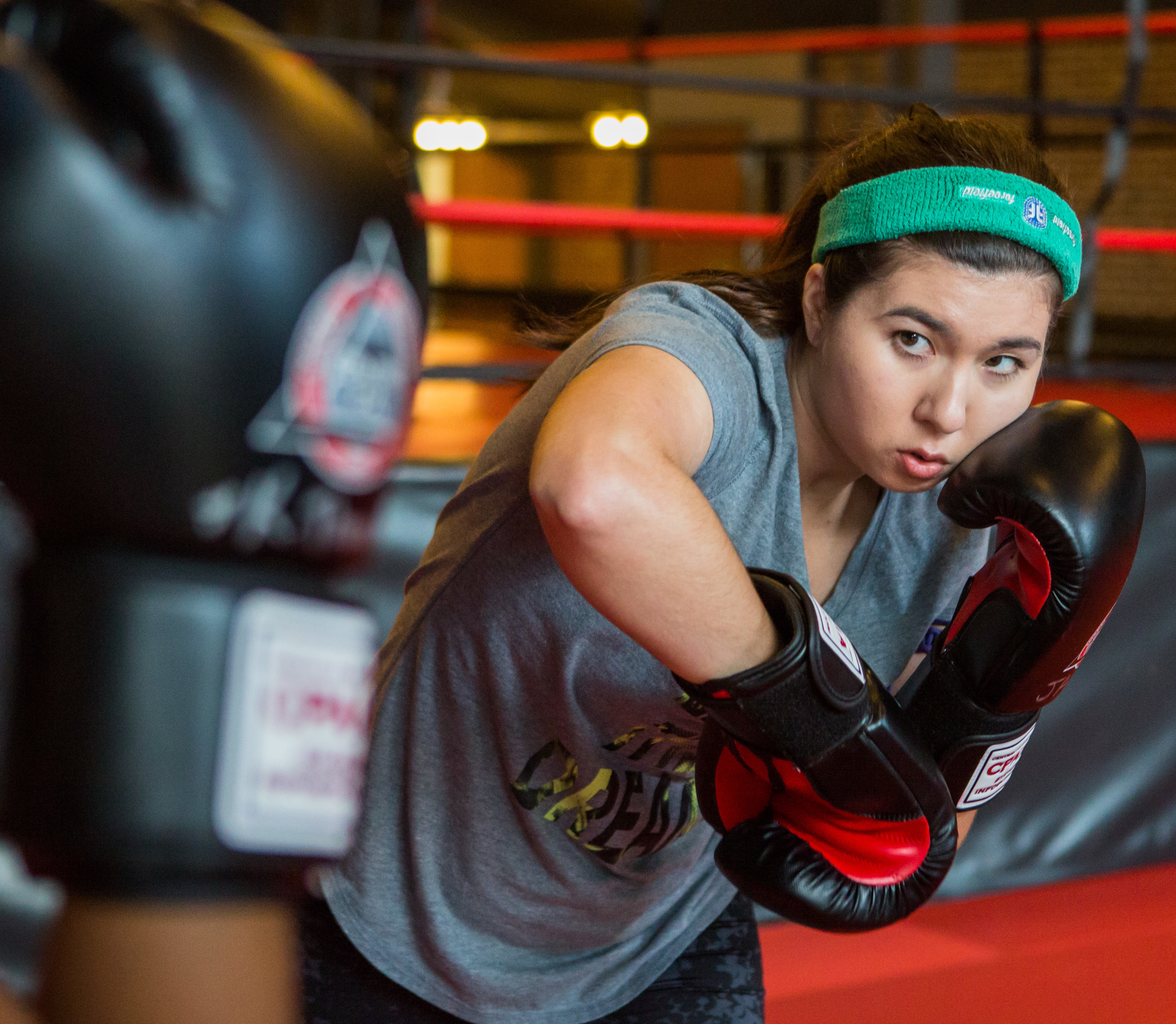 Jacqueline Demartino of State College spars with Kristen Thomas during women's only sparring day at Central PA Mixed Martial Arts in State College on Sunday, July 31, 2016.