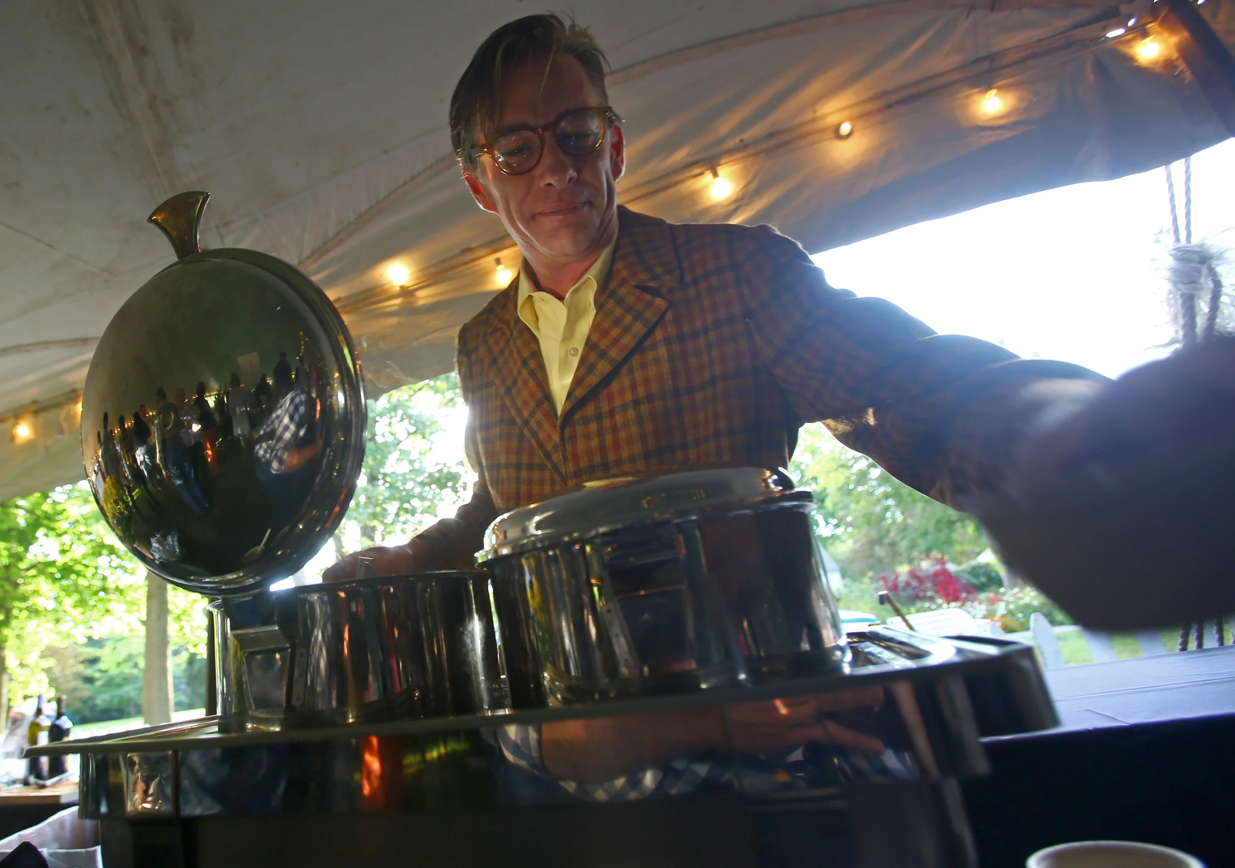 Steve Moss scoops cups of mulligatawny soup at the Pam's Corner booth during the Toledo Grows Harvest Market Dinner held at the Toledo Botanical Gardens on Thursday, Sept. 15, 2016.