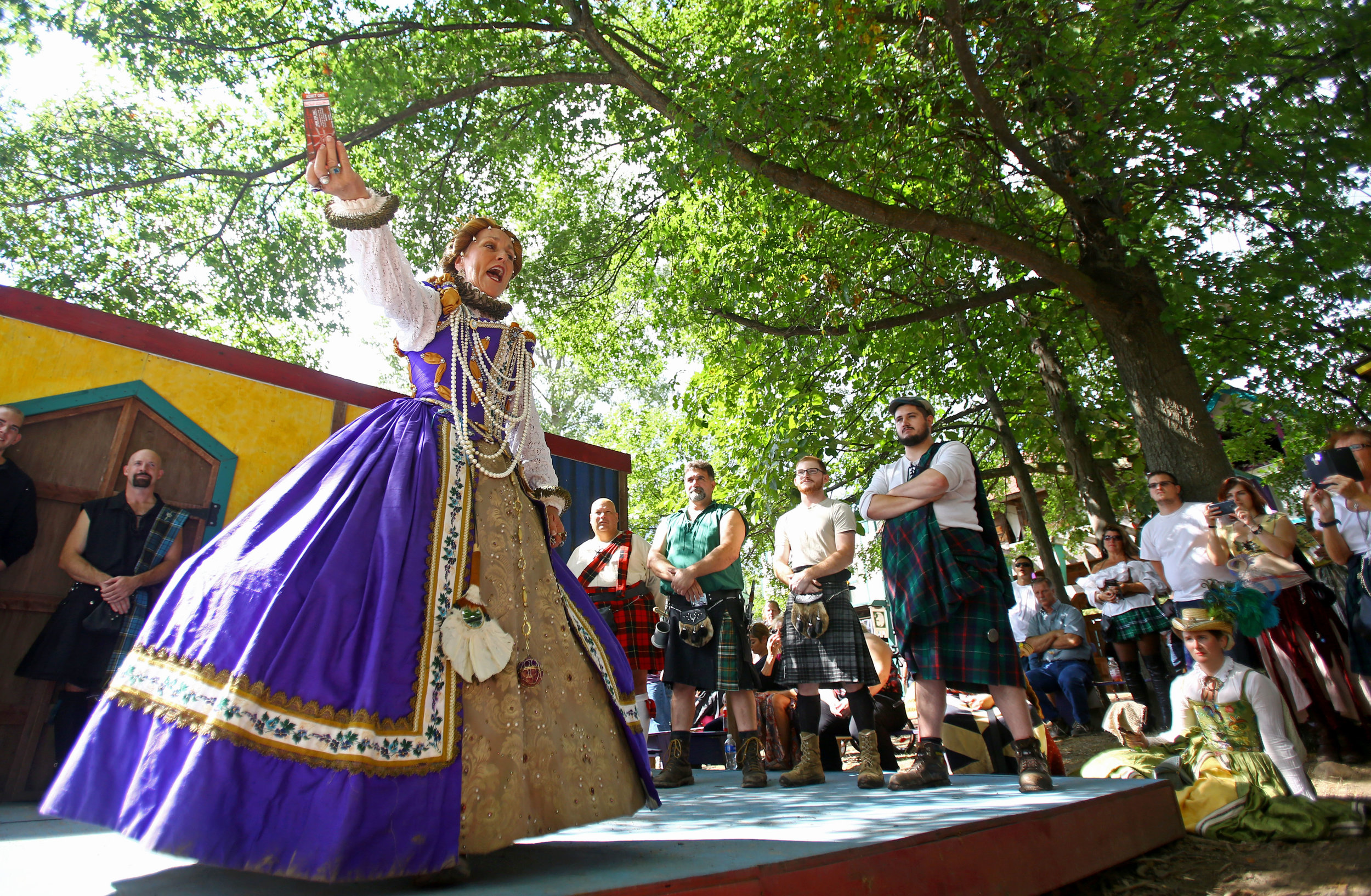 The queen of the renaissance festival announces the winner of "Men in Kilts" competition at the Michigan Renaissance Festival in Holly Michigan on Sunday, Sept. 18.