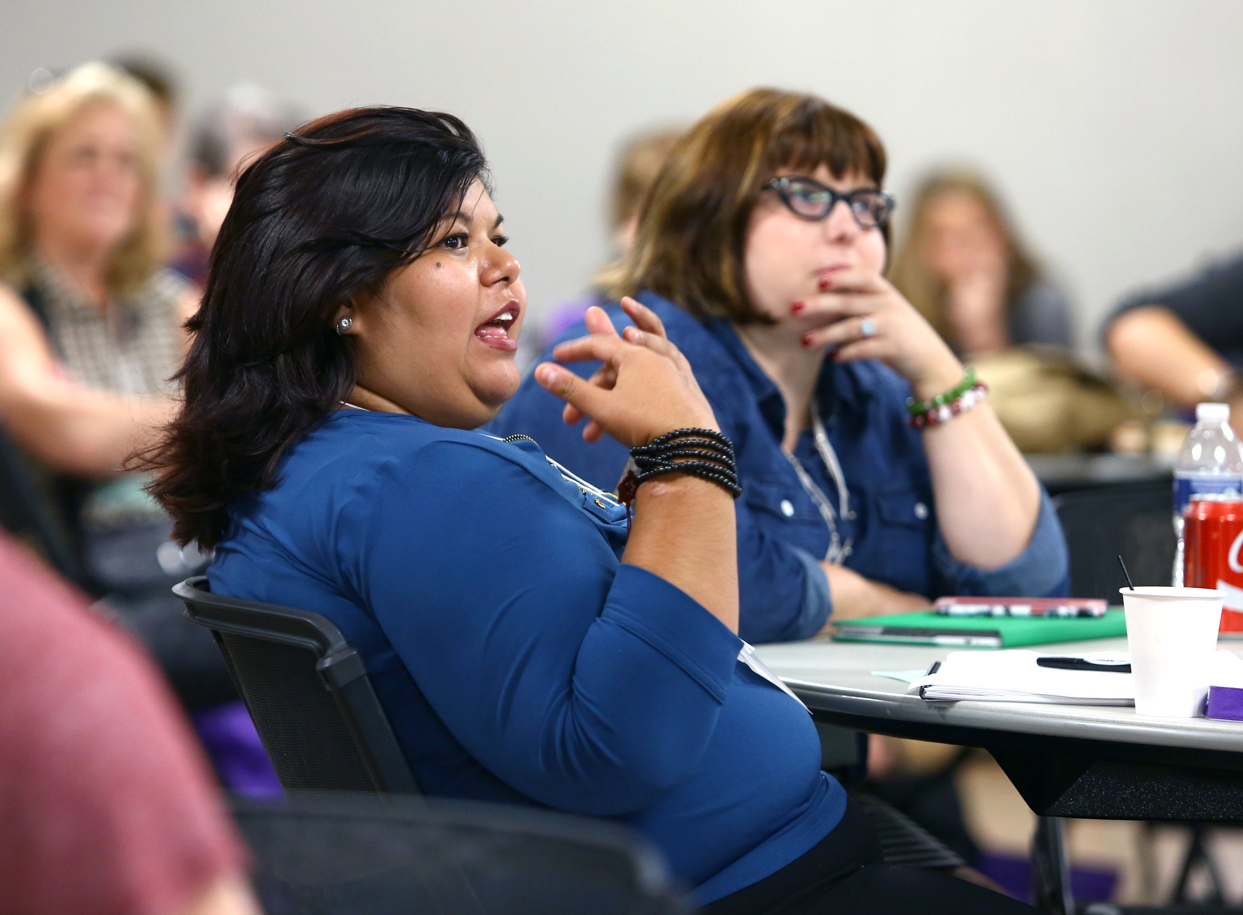 Marlett Garcia of El Paso Tx. interacts with speaker Theresa Flores during the University of Toledo Human Trafficking Social Justice conference held at the university's student union on Thursday, Sept. 22, 2016. 