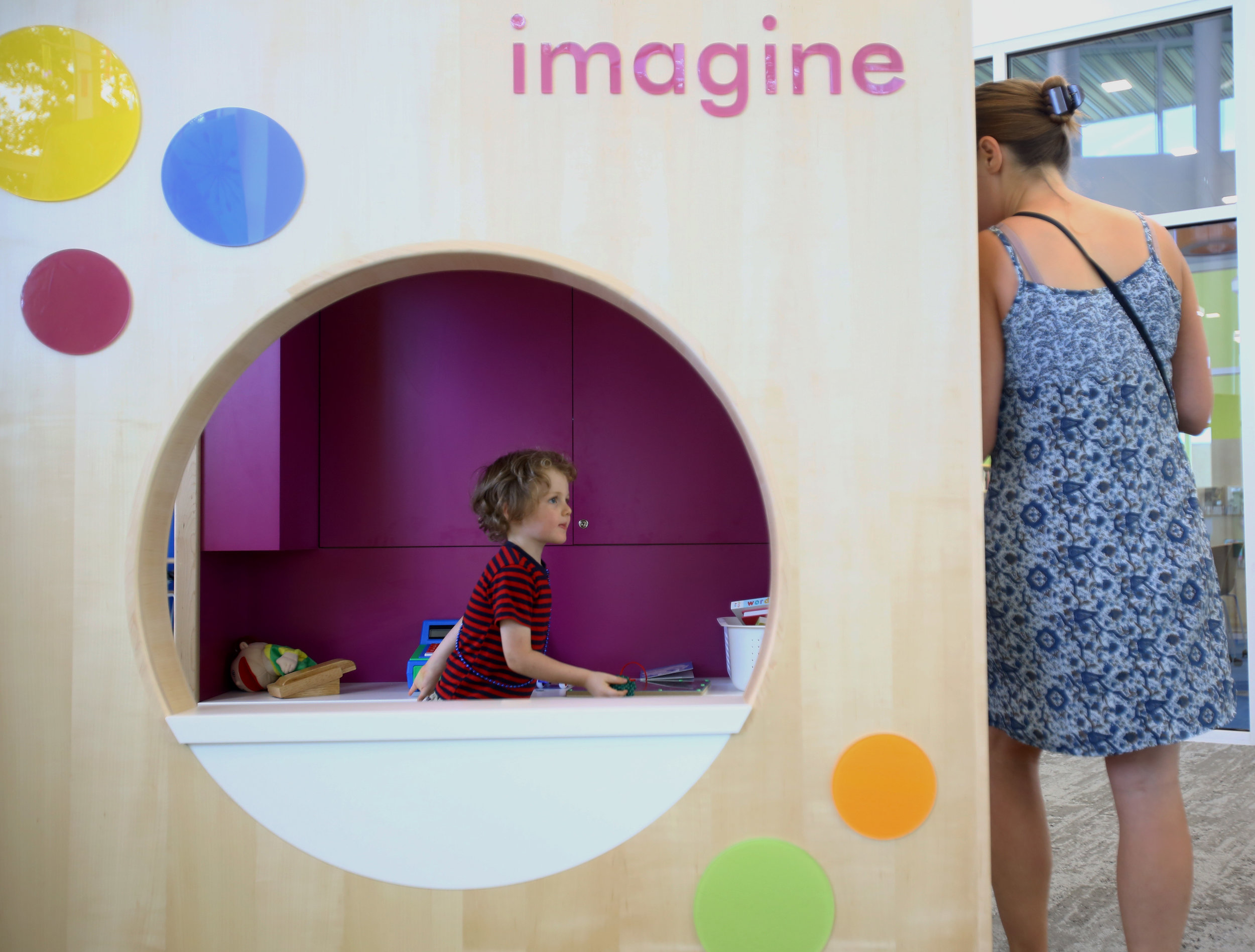 Amos Woods, 4, of Sylvania plays in the children's section of the newly opened King Road branch of the Toledo Lucas County Public Library in Sylvania with his mother Brenda Woods on Monday, Sept. 26, 2016. Brenda Woods saw on Facebook that the library had opened and said that the new branch would be their regular library after always having to go to the Holland branch.